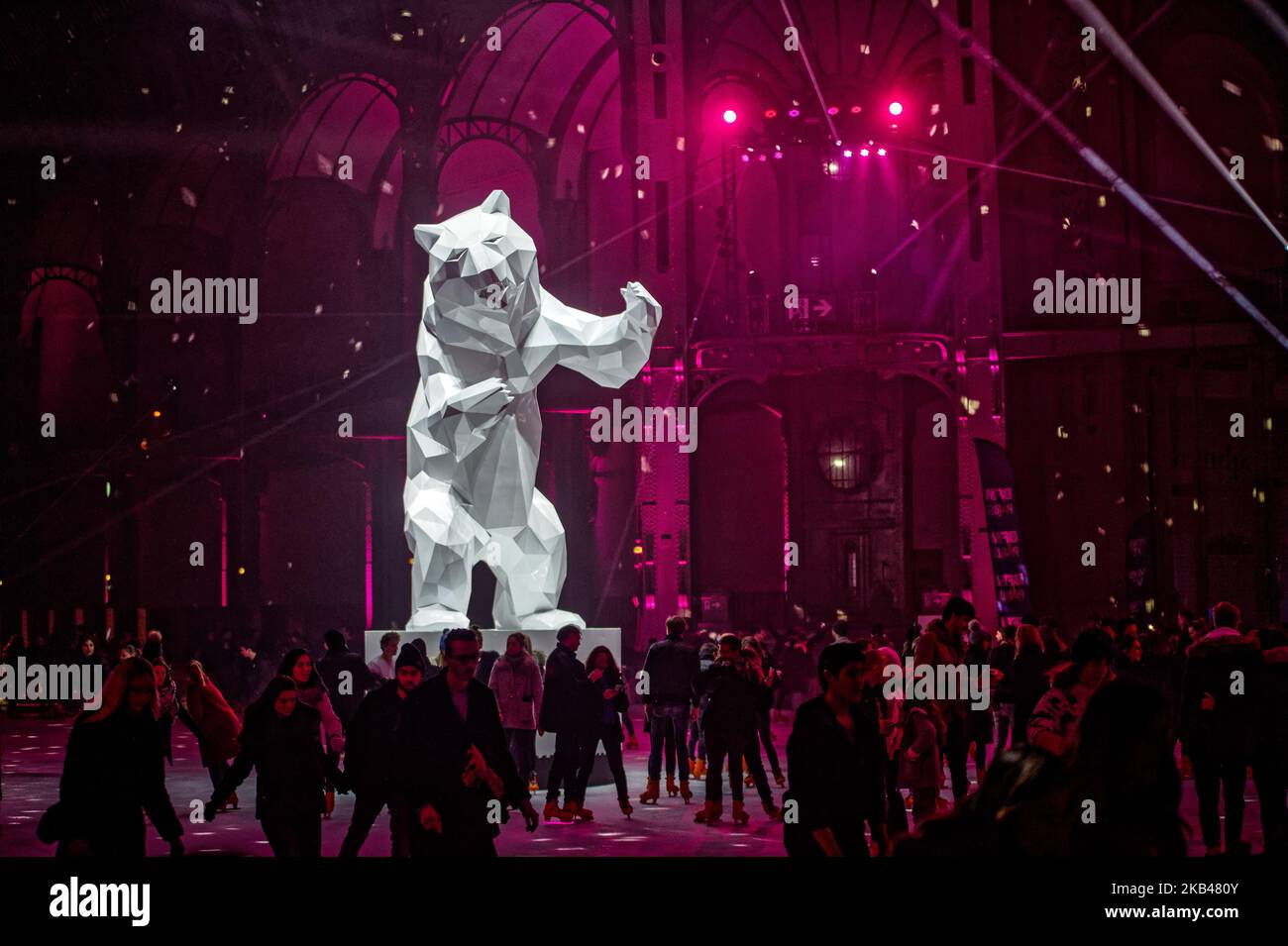 The ice skating rink open to the public during the Christmas holydays hosted under the glass dome of Grand Palais in Paris during the evenings of the end of the year to celebrate holydays and new year. Ligth show , Music with DJ set, and 'Ours' of Richard Orlinski enjoy the people which skating - December 20, 2018 - Paris (Photo by Daniel Pier/NurPhoto)  Stock Photo