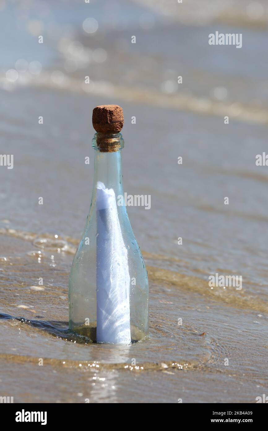 clear glass bottle with a secret message by the sea Stock Photo - Alamy