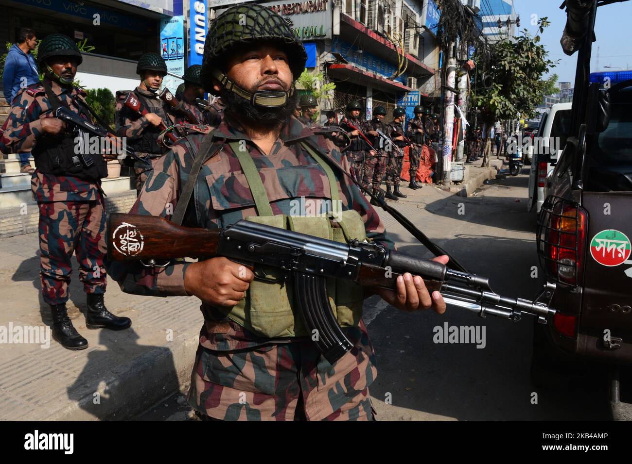 Members of Border Guard Bangladesh (BGB) stand guard in a street for the upcoming election in Dhaka, Bangladesh on December 28, 2018. Election security duties have started to help ensure a peaceful atmosphere and maintain law and order across the country for the 30 December polls. According to the Bangladesh Election Commission, the 11th general election is scheduled on 30 December 2018 to select members of the national parliament in Bangladesh. (Photo by Mamunur Rashid/NurPhoto) Stock Photo