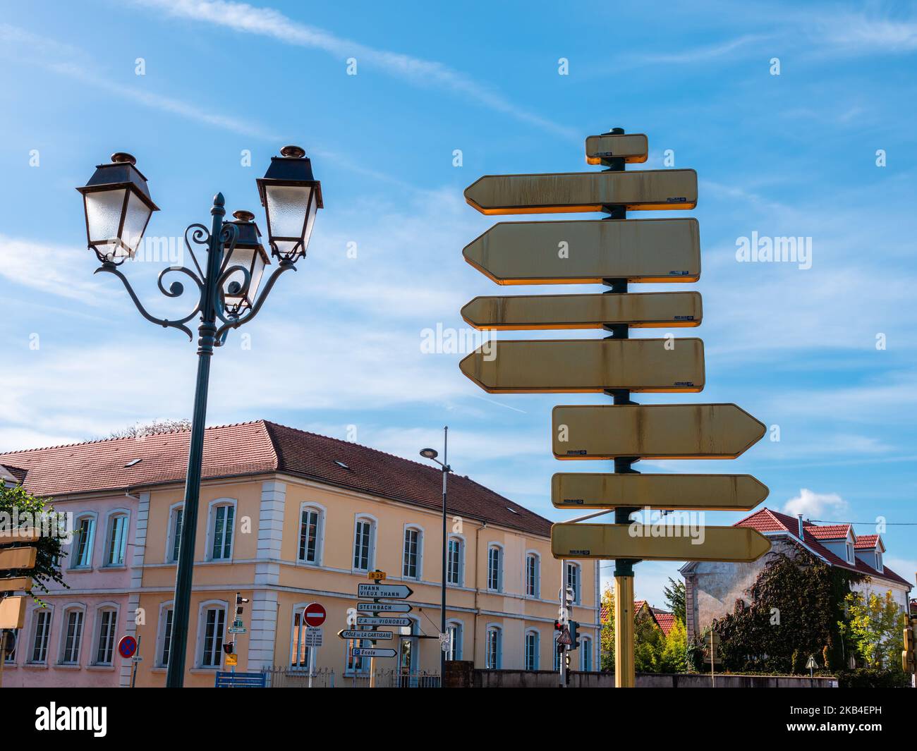 Cernay, France - October 10, 2022: Blank back side of traffic signboards near a street light in Cernay, Alsace. Stock Photo