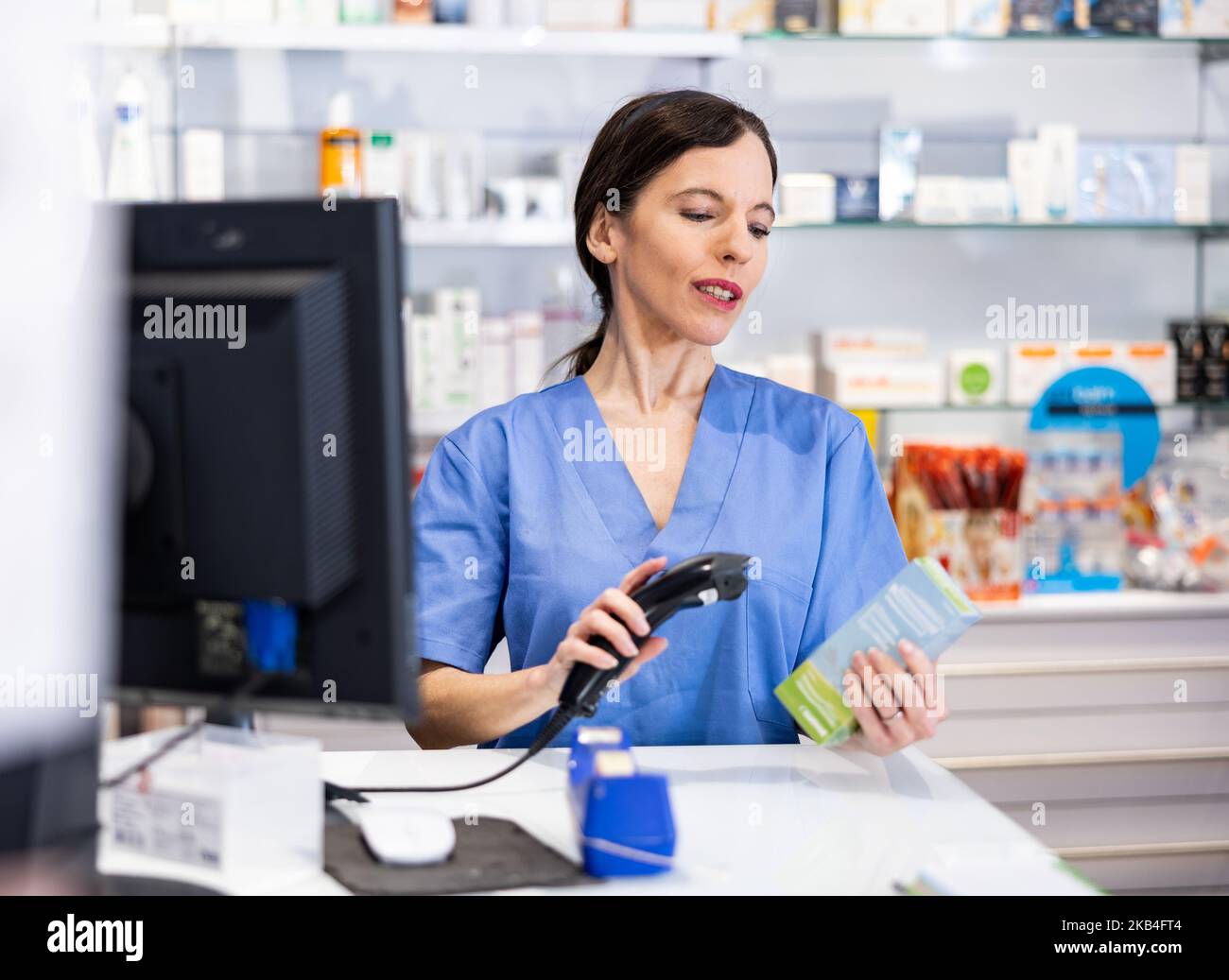 Young woman pharmacist desk hi-res stock photography and images - Alamy