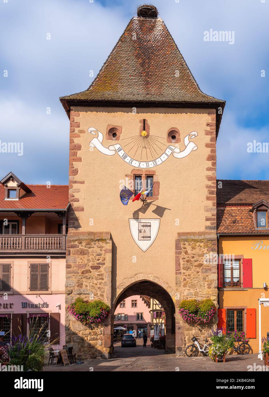 Turckheim, France - October 12, 2022: A tower with a city gate in the old medieval town of Turckheim in Alsace. Stock Photo