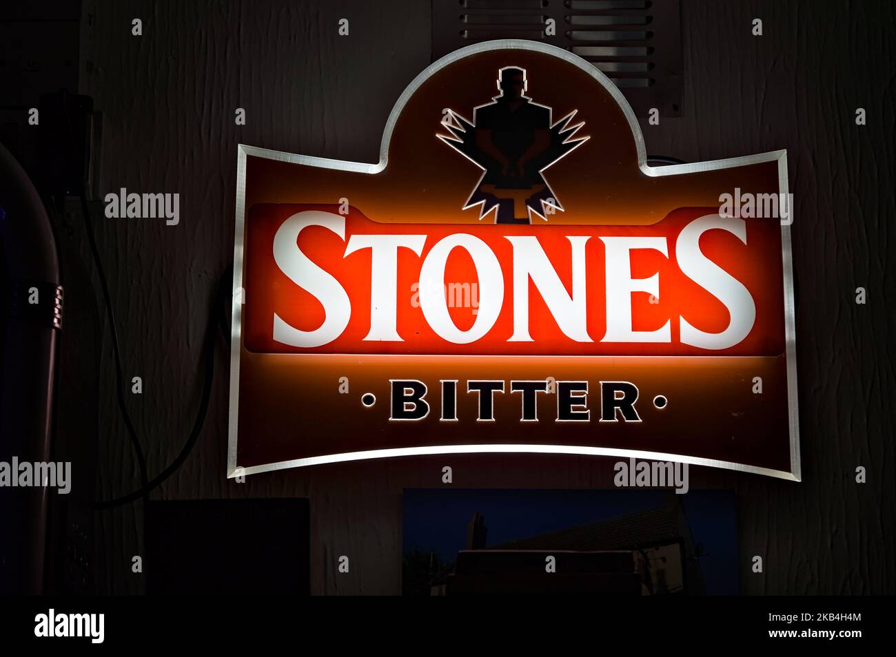 Illuminated Stones bitter brand sign in a local pub. Stock Photo