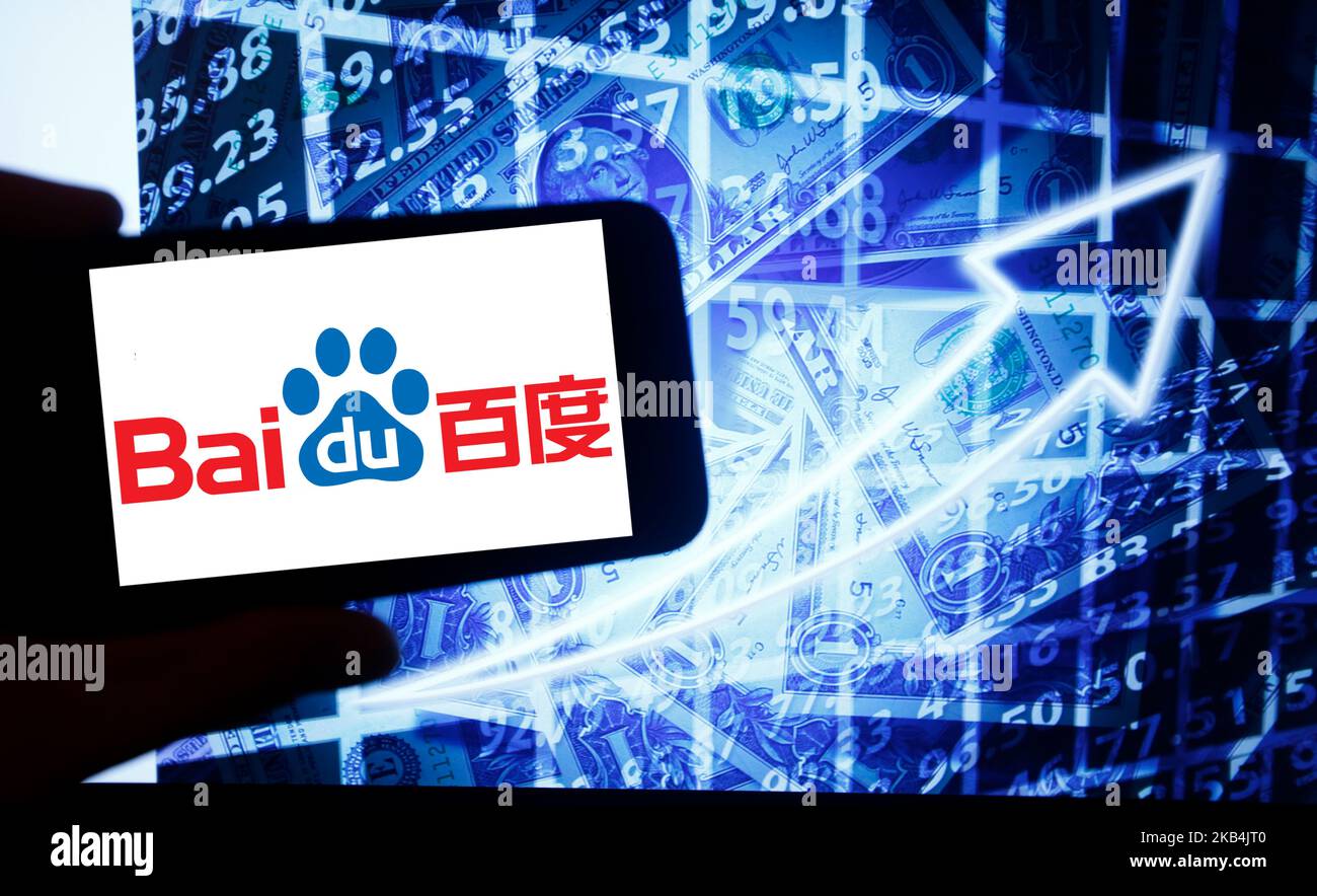 The logo of the Chinese technology corporation Baidu is seen on a screen of a smartphone next to a screen with an illustration ofthe stock market. Baidu is listed in Nasdaq. The Nasdaq is the second-largest stock exchange in the world after the New York Stock Exchange. Baidu is known for its search-engine. (Photo by Alexander Pohl/NurPhoto) Stock Photo