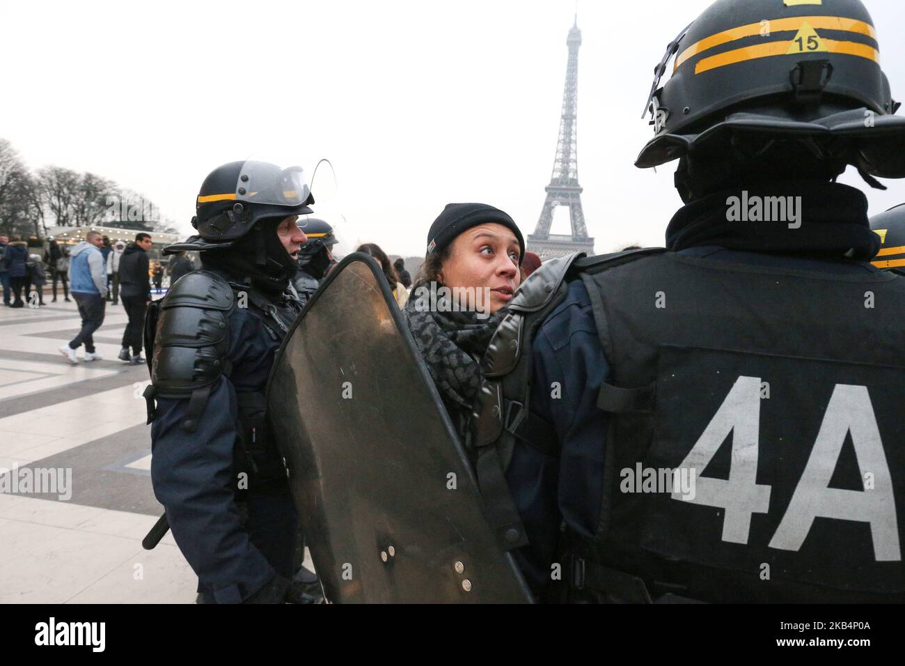 Members of the 'Witch Bloc' feminist group demonstrate behind riot police as they came to disturb the pro-life movement 13th 'March for Life' (Marche pour la vie) anti-abortion rally in Paris on January 20, 2019. Particpants in the march claim to have received the support of Pope Francis and several French bishops. Organizers urged doctors across the country to use their 'conscientious objection' and stop performing abortions. About 200,000 abortions are performed every year in France.Organizers were also marching against a recommendation in September by France's highest bioethics body that si Stock Photo