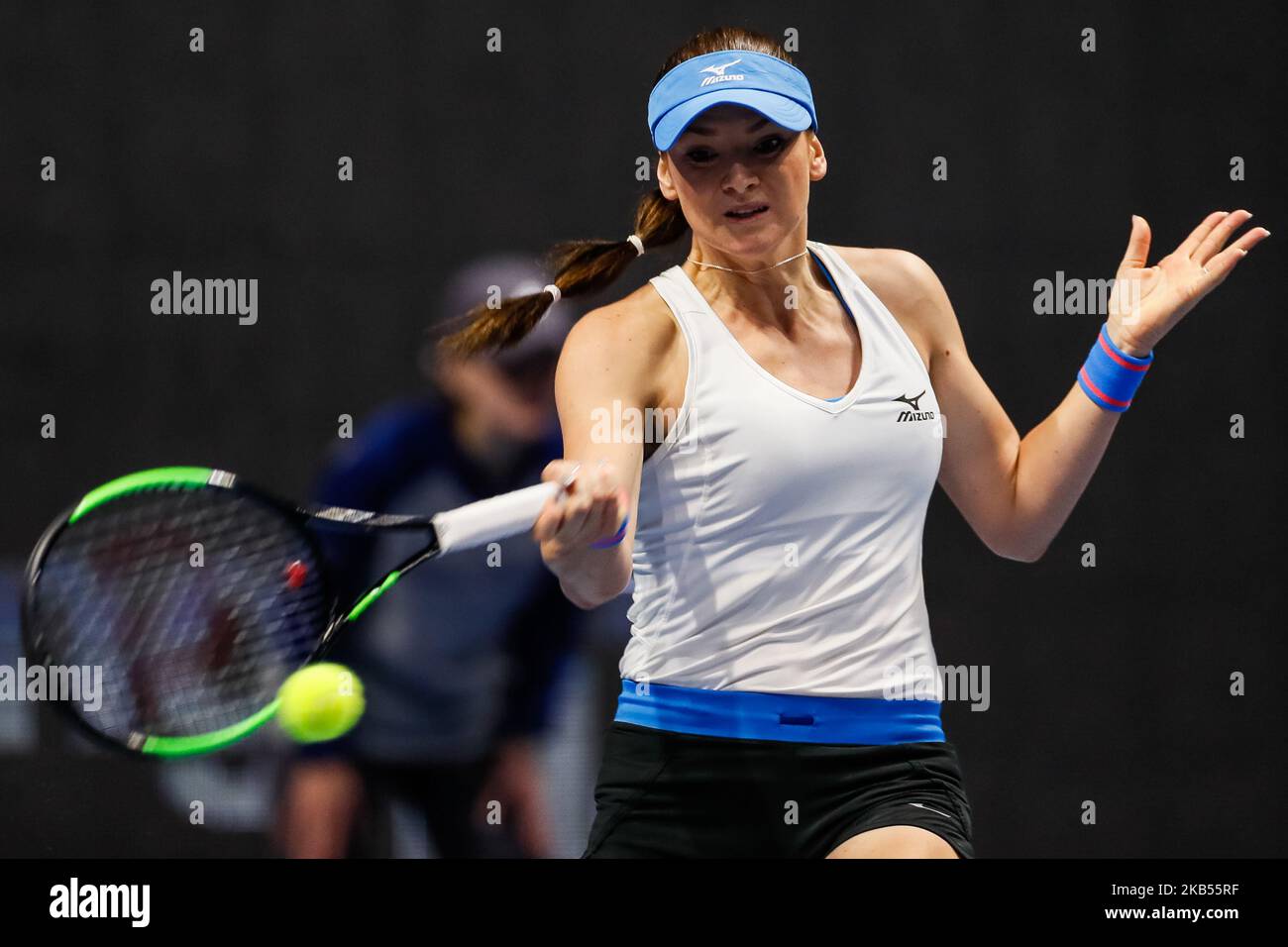 Tereza Martincova of Czech Republic returns the ball to Ekaterina
