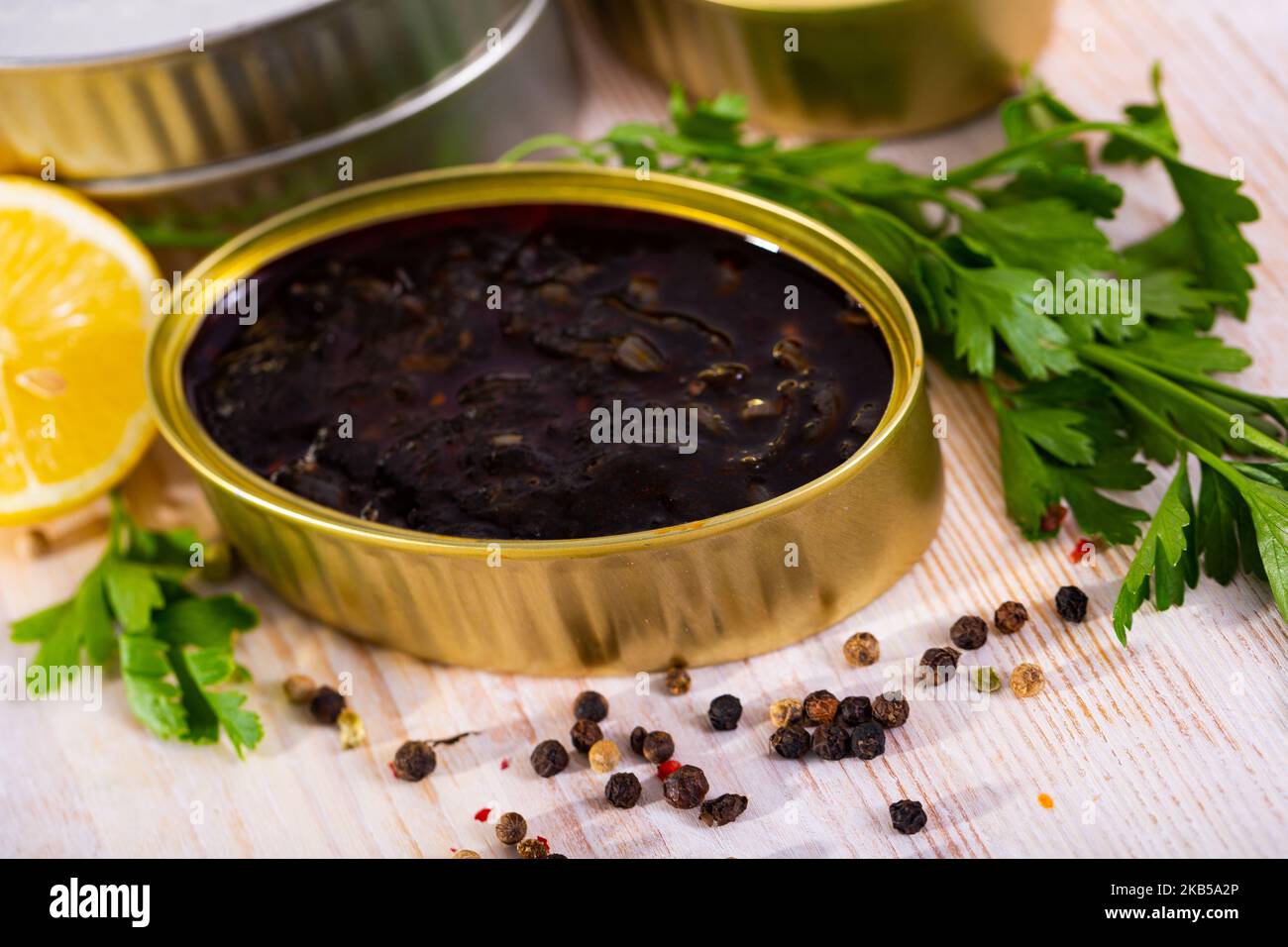 Squid Ink Container Canned seafood, chopped squid in ink Stock Photo - Alamy
