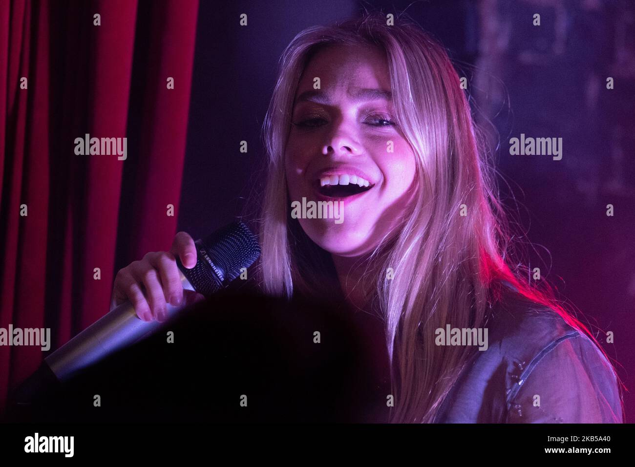 Olivia Devine, professionally known as L Devine performing live at