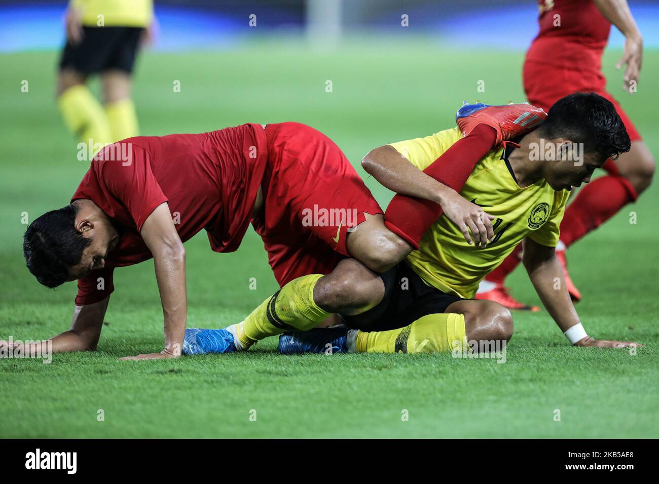 Ricky Fajrin Saputra (left) of Indonesian's in action during FIFA World