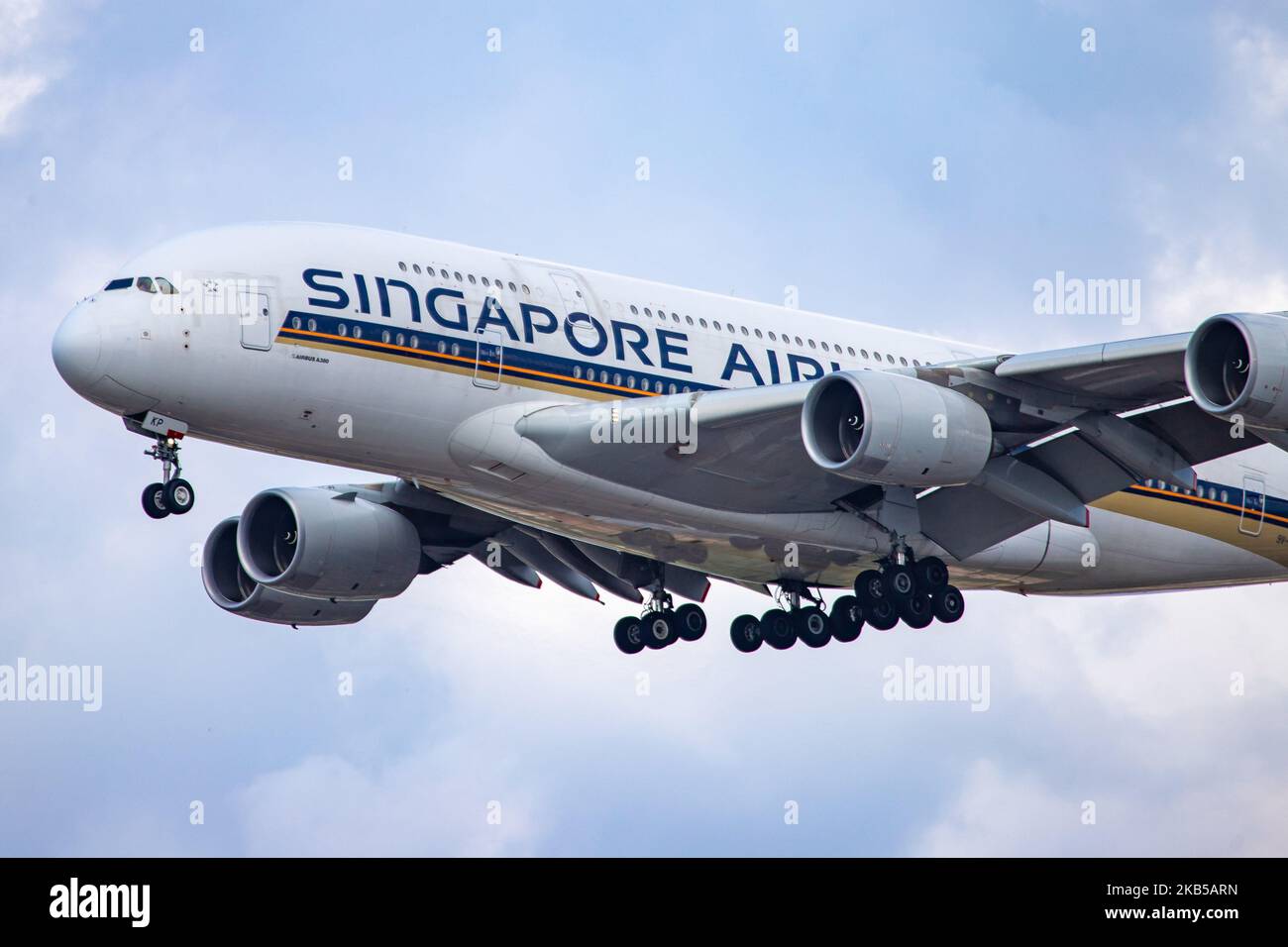 Singapore Airlines Airbus A380 double decker aircraft seen on final approach landing, during a summer day with clouds, at London Heathrow International Airport LHR EGLL on 23 August 2019. The wide body airplane has 4x RR Trent 970 jet engines and registration 9V-SKP. Singapore Airlines SQ SIA is the flag carrier airline of Singapore and is based with hub at Changi Airport SIN WSSS offering daily connections to the British capital. ranked as the world's best airline in 2018 and is member of Star Alliance aviation alliance. (Photo by Nicolas Economou/NurPhoto) Stock Photo