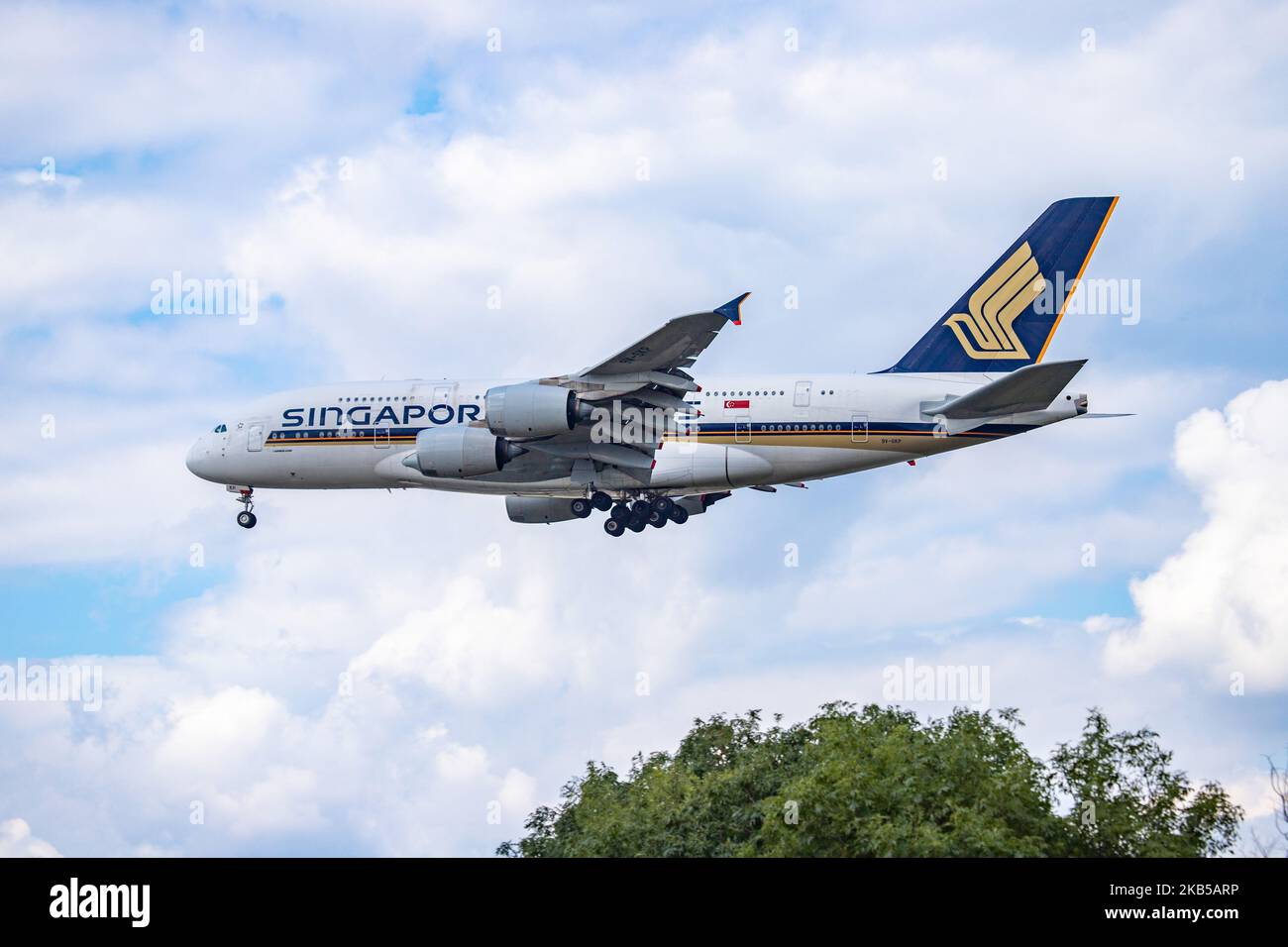 Singapore Airlines Airbus A380 double decker aircraft seen on final approach landing, during a summer day with clouds, at London Heathrow International Airport LHR EGLL on 23 August 2019. The wide body airplane has 4x RR Trent 970 jet engines and registration 9V-SKP. Singapore Airlines SQ SIA is the flag carrier airline of Singapore and is based with hub at Changi Airport SIN WSSS offering daily connections to the British capital. ranked as the world's best airline in 2018 and is member of Star Alliance aviation alliance. (Photo by Nicolas Economou/NurPhoto) Stock Photo