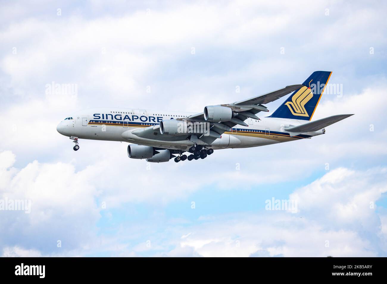 Singapore Airlines Airbus A380 double decker aircraft seen on final approach landing, during a summer day with clouds, at London Heathrow International Airport LHR EGLL on 23 August 2019. The wide body airplane has 4x RR Trent 970 jet engines and registration 9V-SKP. Singapore Airlines SQ SIA is the flag carrier airline of Singapore and is based with hub at Changi Airport SIN WSSS offering daily connections to the British capital. ranked as the world's best airline in 2018 and is member of Star Alliance aviation alliance. (Photo by Nicolas Economou/NurPhoto) Stock Photo