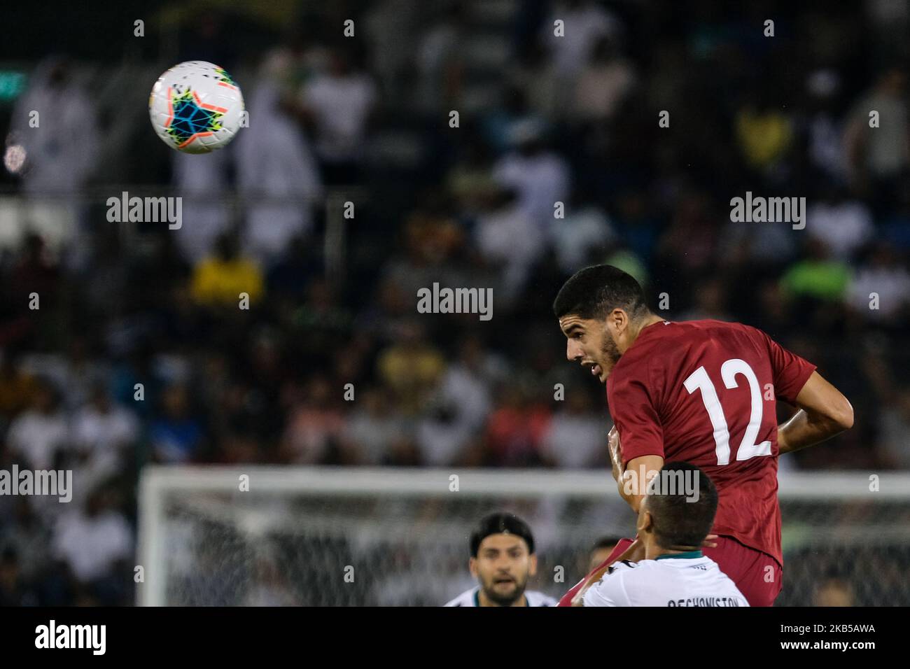 Karim Boudiaf wins a header for Qatar in the World Cup Qualifiers on 5 September 2019 at the Jassim Bin Hamad Stadium, Doha, Qatar. (Photo by Simon Holmes/NurPhoto) Stock Photo