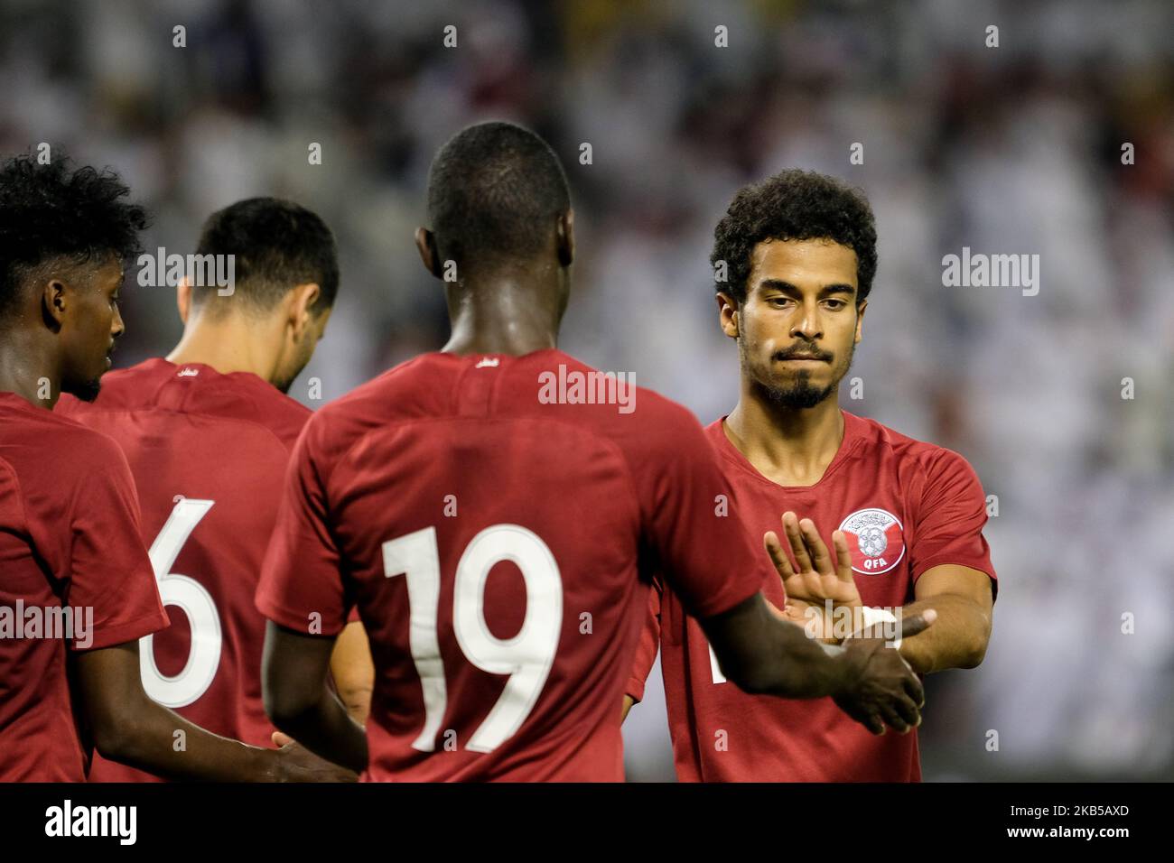 Akram Afif congratulates Almoez Ali on his hat-trick in the World Cup Qualifiers on 5 September 2019 at the Jassim Bin Hamad Stadium, Doha, Qatar. (Photo by Simon Holmes/NurPhoto) Stock Photo