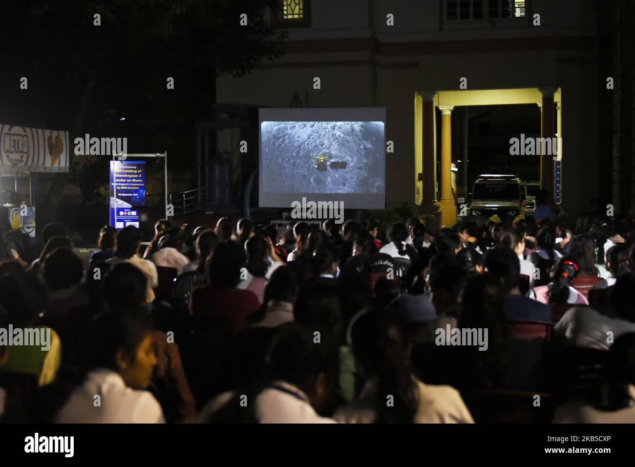 In Kolkata, India, 07 September, 2019, school students watch the live streaming screen of Chandrayaan2 landing on the lunar surface. According to ISRO (Indian Space Research Organisation), Vikram Lander was as planned and normal performance was observed upto an altitude of 2.1km. After few minutes, communication from lander to the ground stations was lost. (Photo by Indranil Aditya/NurPhoto) Stock Photo