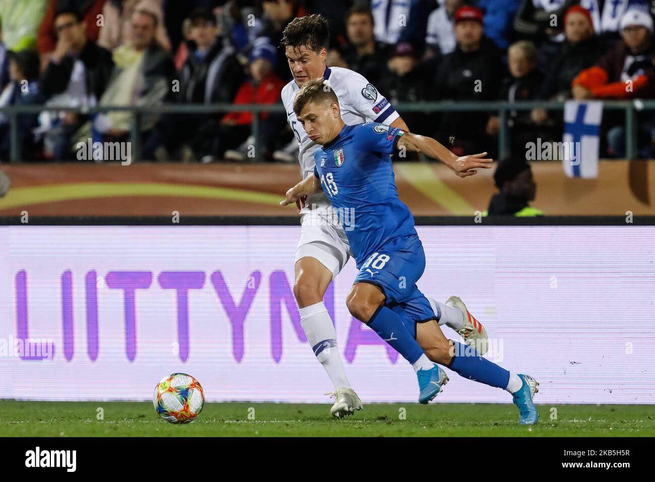 Sauli Vaisanen of Finland and Nicolo Barella (in front) of Italy vie for the ball during UEFA Euro 2020 qualifying match between Finland and Italy on September 8, 2019 at Ratina Stadium in Tampere, Finland. (Photo by Mike Kireev/NurPhoto) Stock Photo