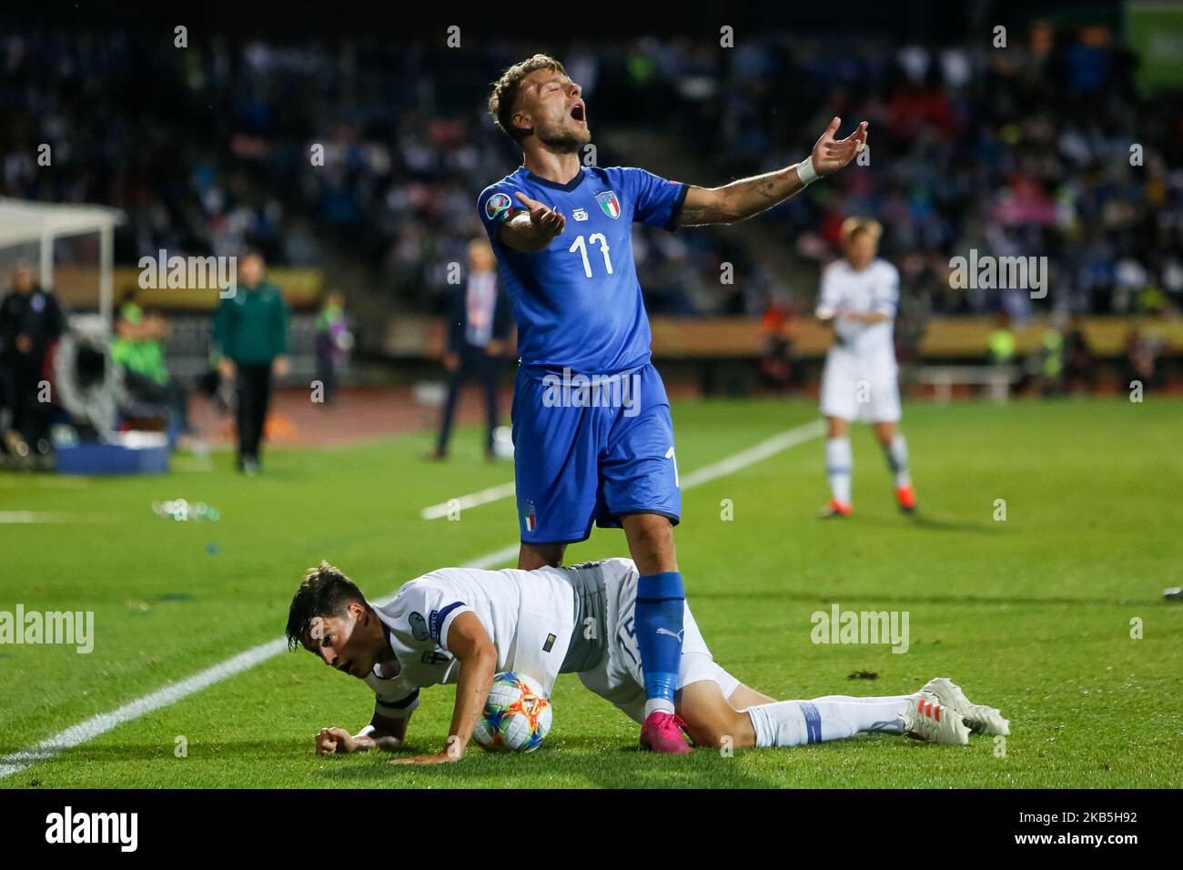 Sauli Vaisanen of Finland and Ciro Immobile (top) of Italy react during UEFA Euro 2020 qualifying match between Finland and Italy on September 8, 2019 at Ratina Stadium in Tampere, Finland. (Photo by Mike Kireev/NurPhoto) Stock Photo