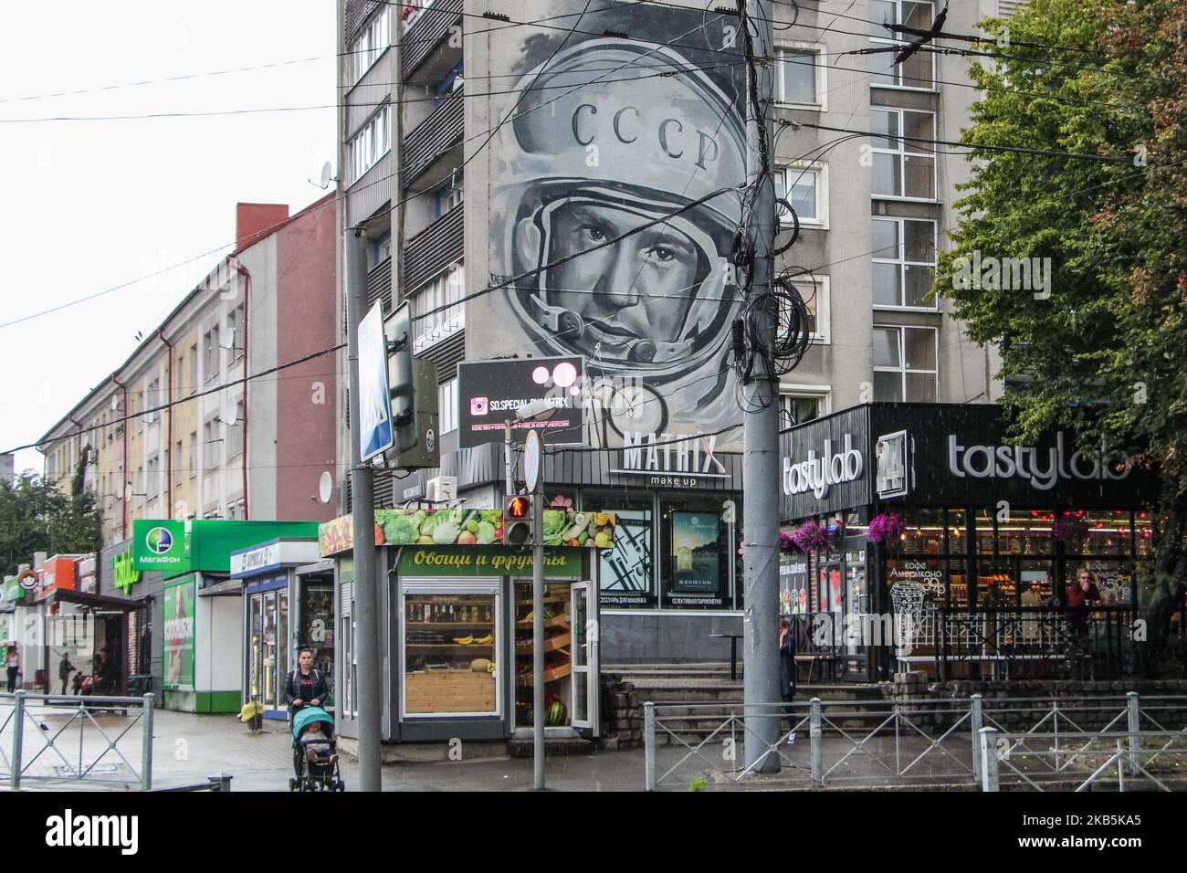 Giant mural with Alexei Leonov (Alexei Arkhipovich Leonov) portrait wearing space helmet is seen in Kaliningrad, Russia, on 8 September 2019 Leonov is the first man to walk in space, and honorary citizen of Kaliningrad. On 18.03.1965, he became the first human to conduct extravehicular activity (EVA), exiting the capsule during the Voskhod 2 mission for a 12-minute spacewalk. (Photo by Michal Fludra/NurPhoto) Stock Photo