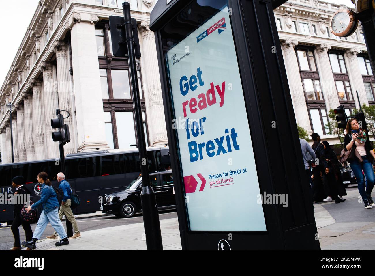 A 'Get ready for Brexit' sign, part of a huge government advertising campaign launched ahead of Britain's scheduled October 31 departure from the EU, lights up an information screen on the corner of North Audley Street and Oxford Street in London, England, on September 10, 2019. MPs last night voted for a second time to deny Prime Minister Boris Johnson a general election before Britain's scheduled departure from the European Union on October 31. Speaking ahead of the vote, the prime minister insisted that he would not ask the EU for any further extension to Brexit, leaving him now with few op Stock Photo