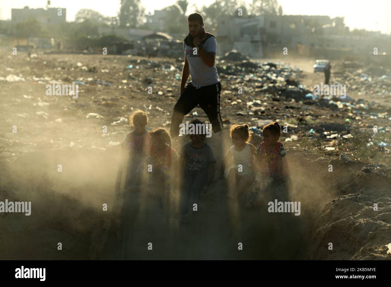 Palestinian children play on the land of Gaza destroyed airport, in Rafah in the southern Gaza Strip September 10, 2019. (Photo by Majdi Fathi/NurPhoto) Stock Photo