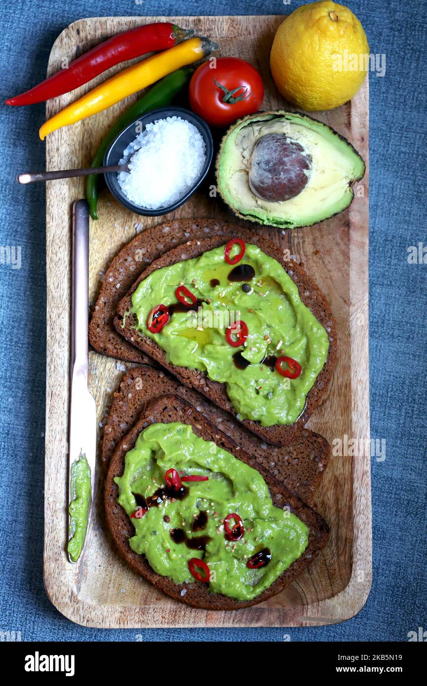 Guacamole toasted with hot peppers and olive oil. Healthy food. Keto diet. Stock Photo