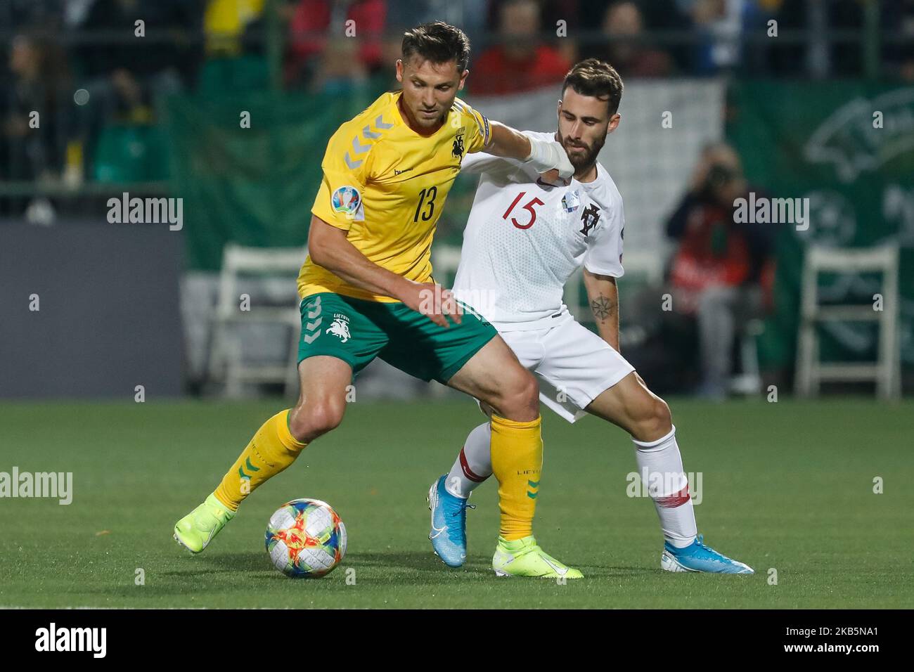 Saulius Mikoliunas (L) of Lithuania and Rafa Silva of Portugal vie for the ball during the UEFA Euro 2020 qualifying match between Lithuanua and Portugal on September 10, 2019 at LFF Stadium in Vilnius, Lithuania. (Photo by Mike Kireev/NurPhoto) Stock Photo