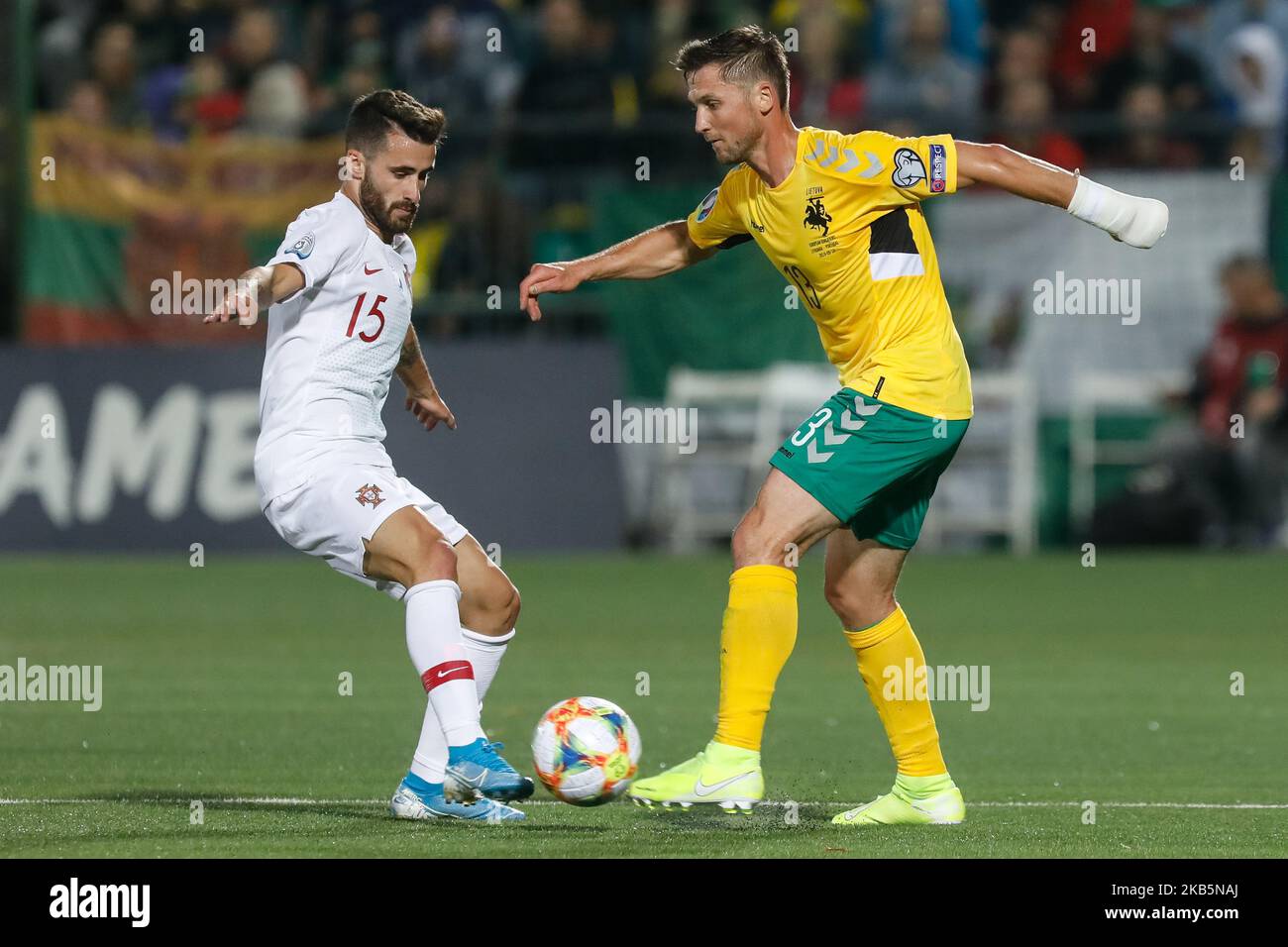 Saulius Mikoliunas (R) of Lithuania and Rafa Silva of Portugal vie for the ball during the UEFA Euro 2020 qualifying match between Lithuanua and Portugal on September 10, 2019 at LFF Stadium in Vilnius, Lithuania. (Photo by Mike Kireev/NurPhoto) Stock Photo