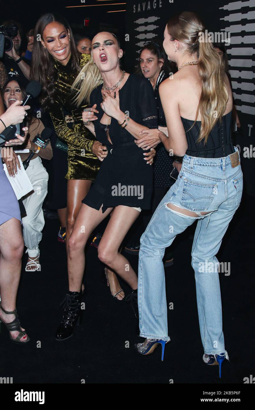 BROOKLYN, NEW YORK CITY, NEW YORK, USA - SEPTEMBER 10: Joan Smalls, Cara  Delevingne and Gigi Hadid arrive at the Savage X Fenty Show Presented By  Amazon Prime Video held at Barclays