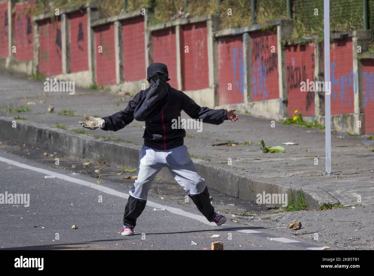 Hooded man in riots hi-res stock photography and images - Alamy