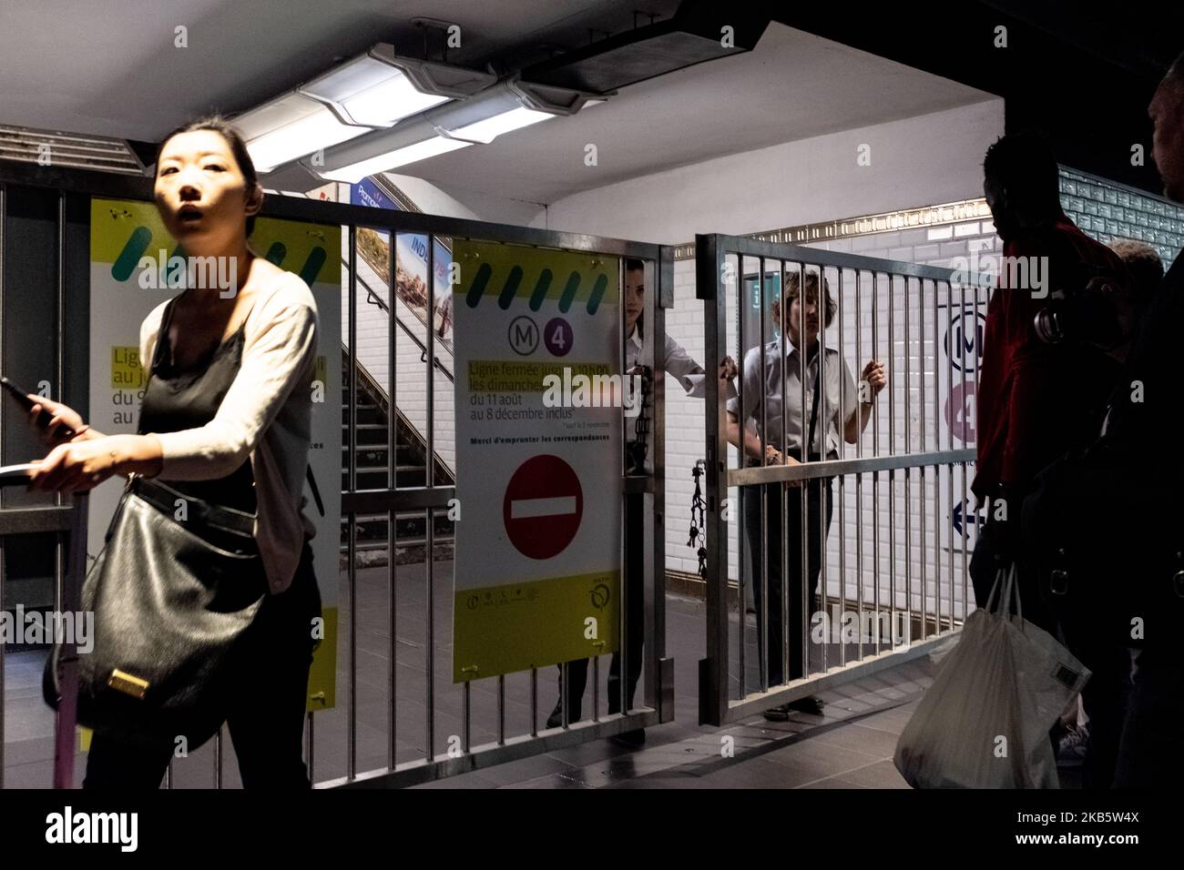 RATP employees are closing the access gates to the platforms at Chatelet station as traffic has just been interrupted during the strike on Friday, September 13, 2019, while all the unions of RATP, the Paris transport authority that operates the capital's metro lines, have started a strike to protest against the reform of pension schemes and the end of their special schemes. Most of the metro lines in Paris were disrupted, including 10 completely closed metro lines. Parisians anticipated the strike by limiting their travel as much as possible and by taking a day off or dealing with telework. In Stock Photo