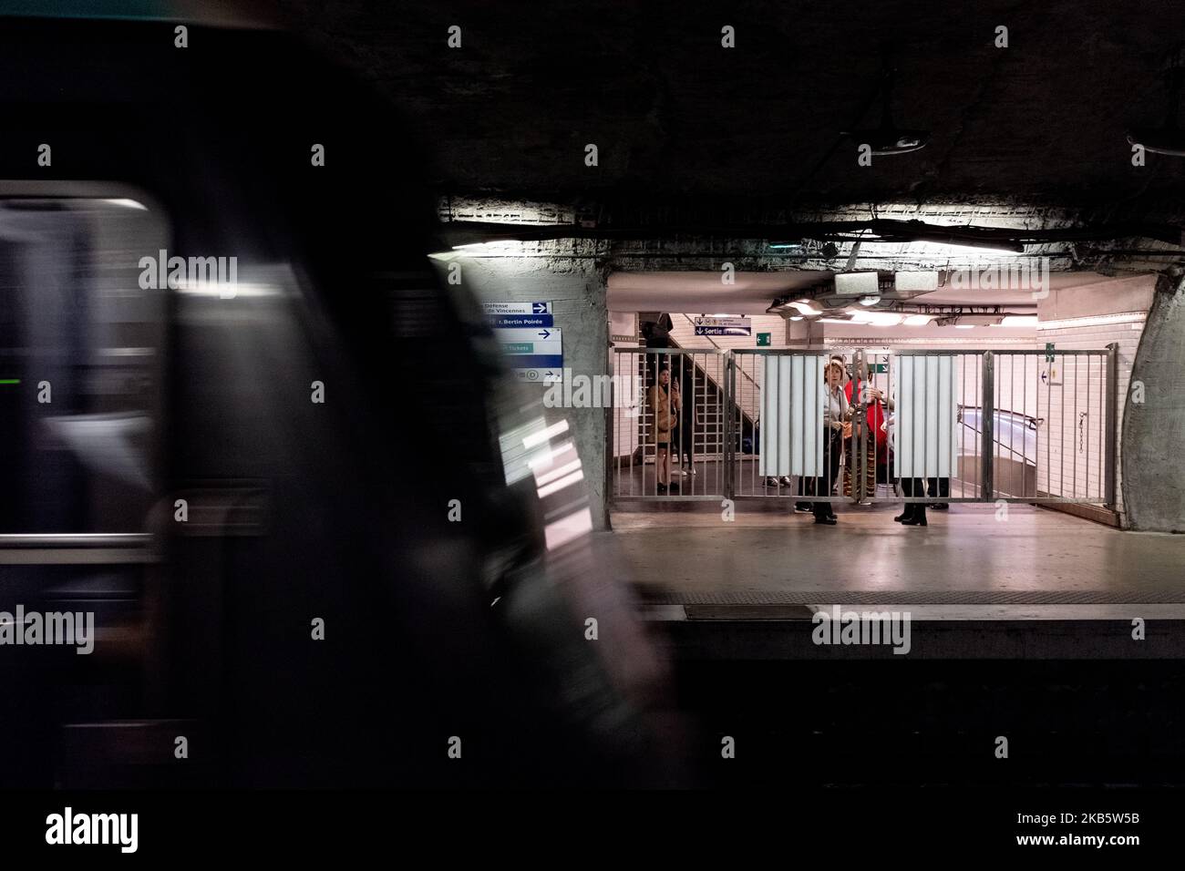 RATP employees are closing the access gates to the platforms at Chatelet station as traffic has just been interrupted during the strike on Friday, September 13, 2019, while all the unions of RATP, the Paris transport authority that operates the capital's metro lines, have started a strike to protest against the reform of pension schemes and the end of their special schemes. Most of the metro lines in Paris were disrupted, including 10 completely closed metro lines. Parisians anticipated the strike by limiting their travel as much as possible and by taking a day off or dealing with telework. In Stock Photo