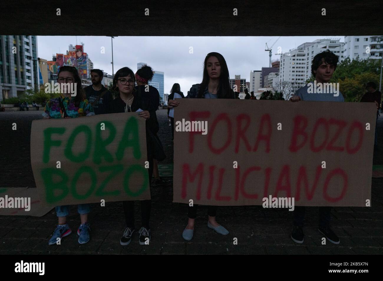 Demonstrators show a papers that reads: 'out Bozo' (Bozo is a derogatory nickname that refers to a clown and also to the President Jair Bolsonaro) during protest against the President Jair Bolsonaro government at Paulista avenue in São Paulo, Brazil, September 13, 2019. (Footage by Felipe Beltrame/NurPhoto) Stock Photo