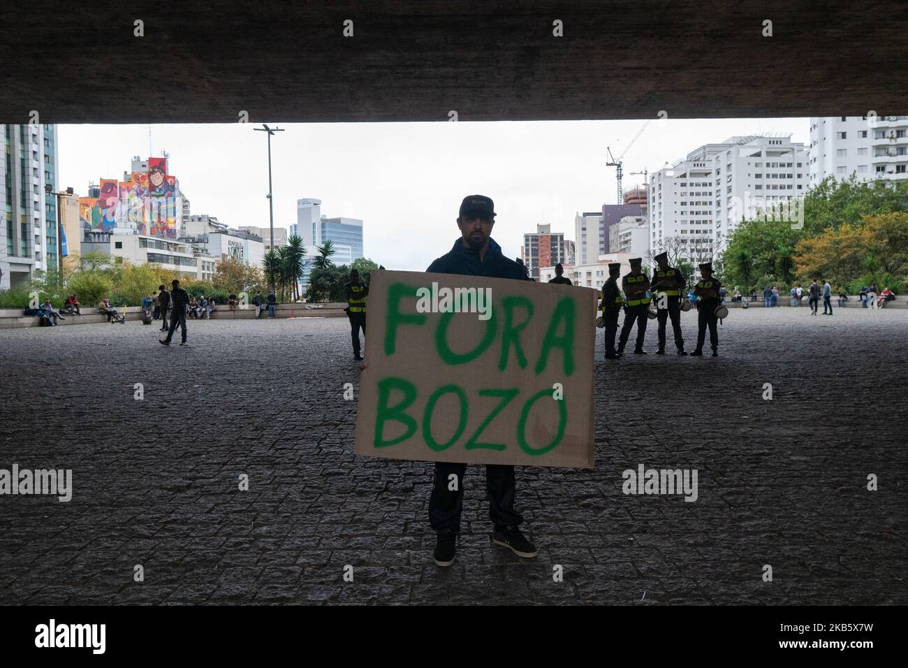 Demonstrator shows a paper that reads: 'out Bozo' (Bozo is a derogatory nickname that refers to a clown and also to the President Jair Bolsonaro) during protest against the President Jair Bolsonaro government at Paulista avenue in São Paulo, Brazil, September 13, 2019. (Footage by Felipe Beltrame/NurPhoto) Stock Photo