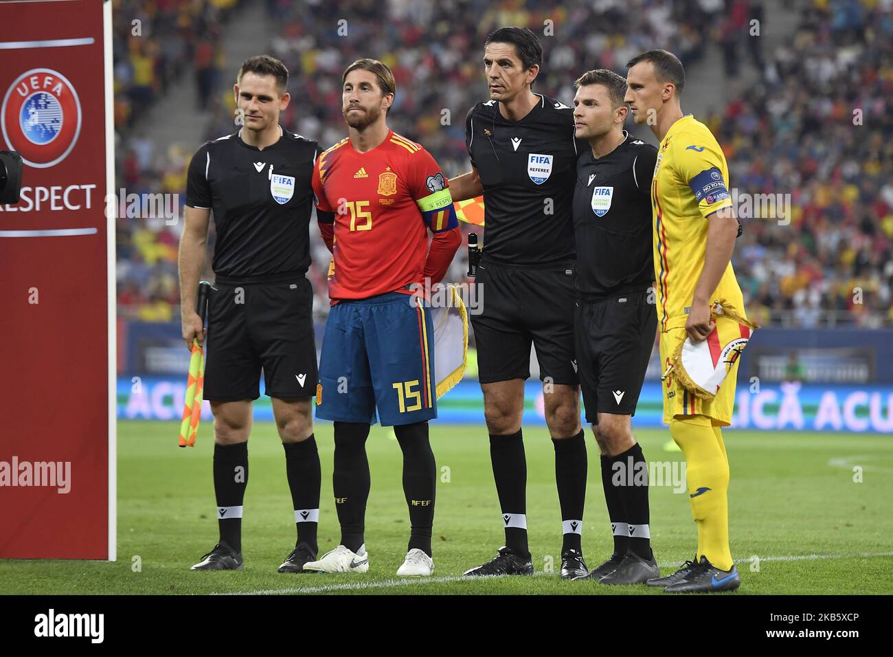 Spain's captain Sergoi Ramos and Romania's captain Vlad Chiriches pose for the official photo tighter with the referee Deniz Aytekin and the assistant referees Eduard Beitinger and Rafael Foltyn during the UEFA EURO 2020 group F qualifying football match Romania vs Spain at Arena Nationala on September 05, 2019 in Bucharest, Romania. (Photo by Alex Nicodim/NurPhoto) Stock Photo