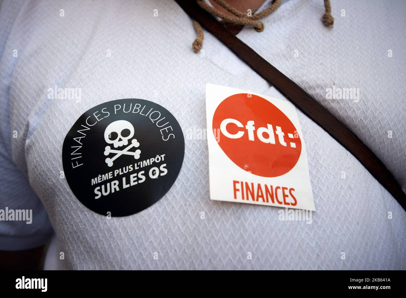 A sticker reads 'Public finance: not even taxes on the bones'. Civil servants from the DGFIP (General Directorate of Public Finance) and mayors gathered in front of the Prefecture of Haute-Garonne to protest against the Darmanin's plan to close down tax offices across France. Darmaninis the finance minister. In the Haute-Garonne department, 25 tax offices will be closd and in the Lot-et-Garonne department, for example, all tax offices will be closed before 2023. Toulouse. France. September 16th 2019. (Photo by Alain Pitton/NurPhoto) Stock Photo