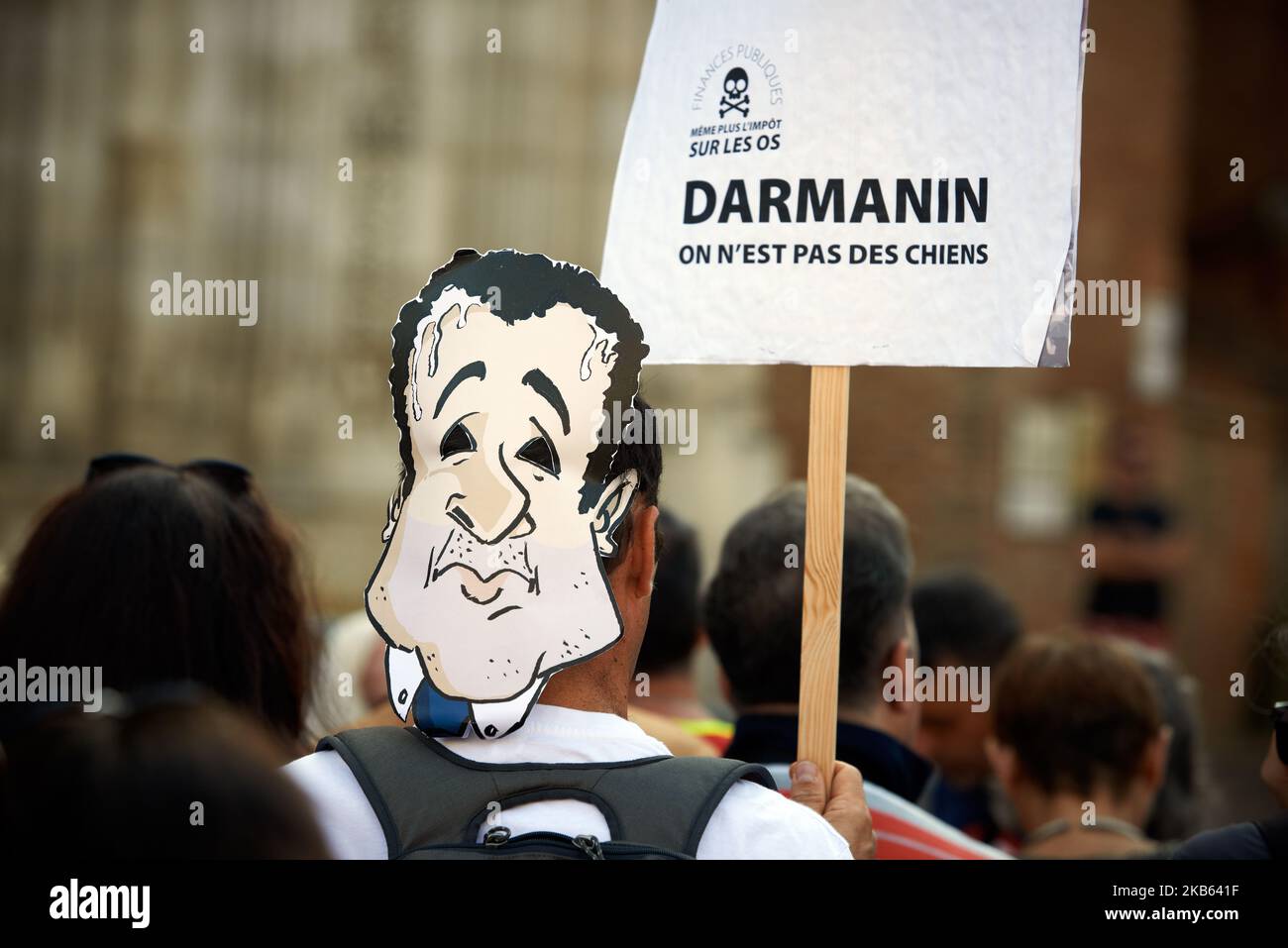 A placar dreads 'Darmanin, we are not dogs'. Civil servants from the DGFIP (General Directorate of Public Finance) and mayors gathered in front of the Prefecture of Haute-Garonne to protest against the Darmanin's plan to close down tax offices across France. Darmaninis the finance minister. In the Haute-Garonne department, 25 tax offices will be closd and in the Lot-et-Garonne department, for example, all tax offices will be closed before 2023. Toulouse. France. September 16th 2019. (Photo by Alain Pitton/NurPhoto) Stock Photo