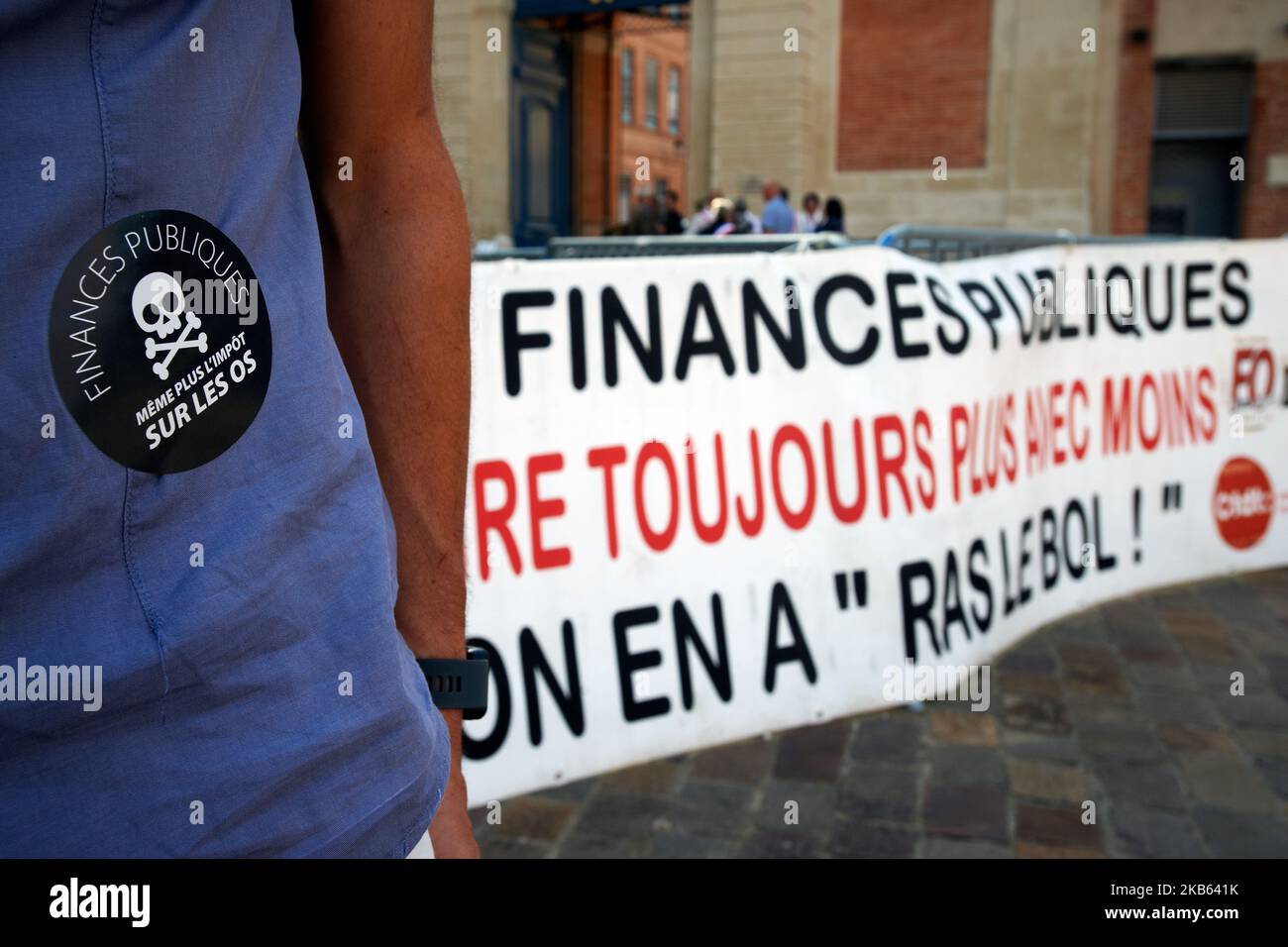 A banner reads 'Public Finance, doing more with less, we're fed up with this'. Civil servants from the DGFIP (General Directorate of Public Finance) and mayors gathered in front of the Prefecture of Haute-Garonne to protest against the Darmanin's plan to close down tax offices across France. Darmaninis the finance minister. In the Haute-Garonne department, 25 tax offices will be closd and in the Lot-et-Garonne department, for example, all tax offices will be closed before 2023. Toulouse. France. September 16th 2019. (Photo by Alain Pitton/NurPhoto) Stock Photo