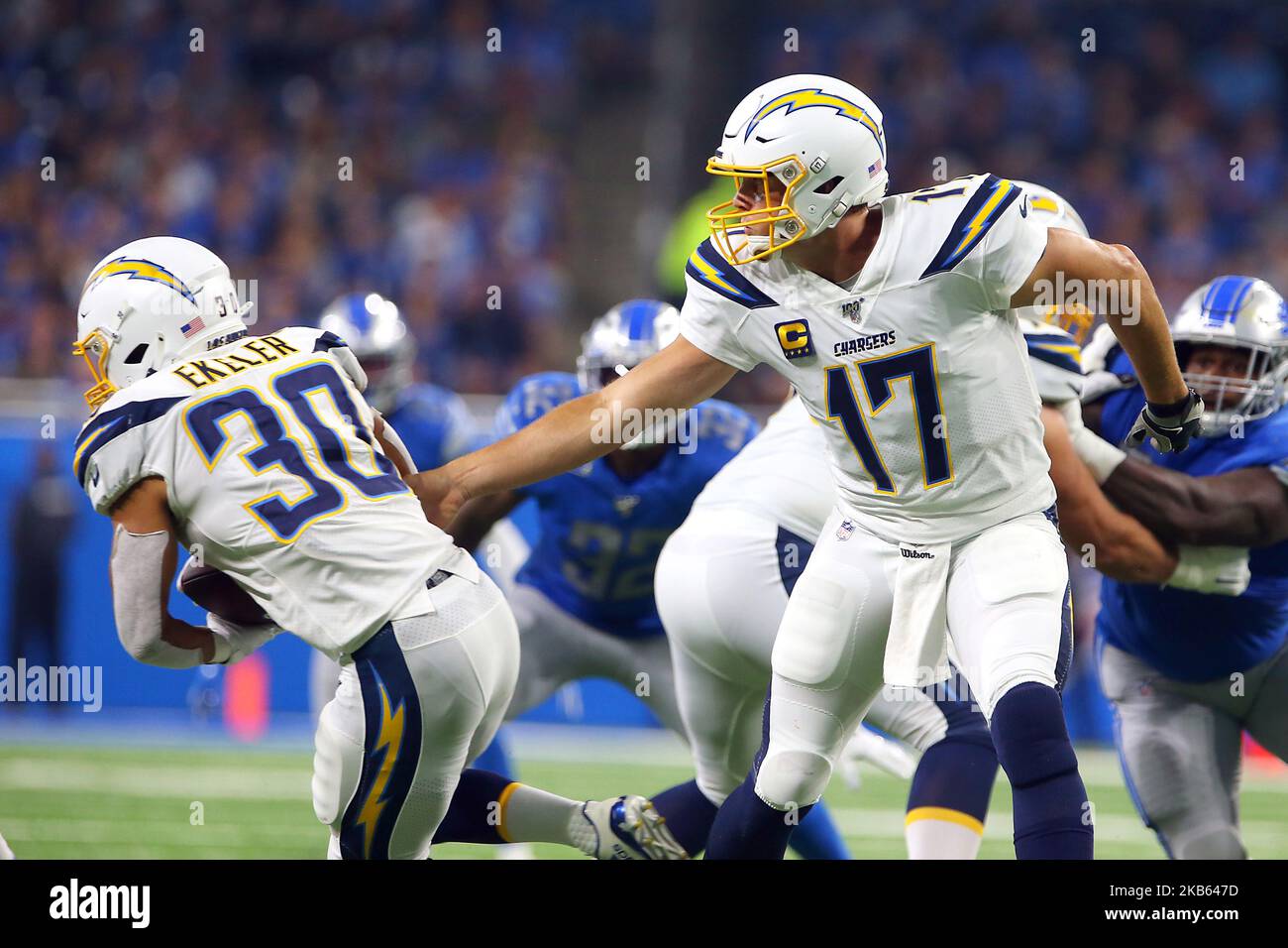 Los Angeles Chargers quarterback Philip Rivers (17) hands off the ball to Los  Angeles Chargers running back Austin Ekeler (30) during the first half of  an NFL football game against the Detroit