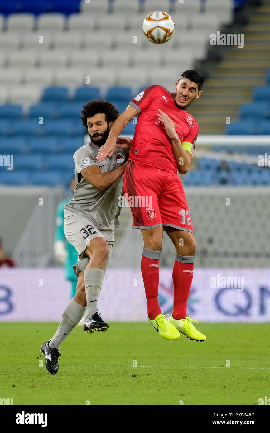Karim Boudiaf wins a header against Ahmed Abdelmaqsoud during Al-Duhail 1-1 Al Rayyan in the Qatar Stars League on 15 September 2019 at the Al Janoub Stadium in Al Wakrah, Qatar. (Photo by Simon Holmes/NurPhoto) Stock Photo