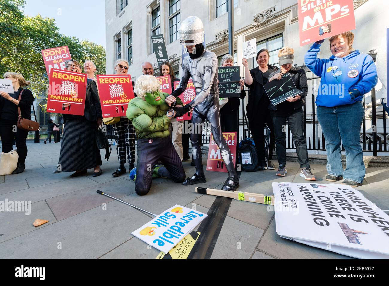 Protesters dressed as a movie character RoboCop (R) and the comic-book character the Incredible Hulk (L) take part in a demonstrators outside the Supreme Court against Boris Johnson's suspension of parliament on 17 September, 2019 in London, England. Today, the Supreme Court judges begin a three-day hearing over the claim that Prime Minister Boris Johnson acted unlawfully in advising the Queen to prorogue parliament for five weeks in order to prevent MPs from debating the Brexit crisis. (Photo by WIktor Szymanowicz/NurPhoto) Stock Photo