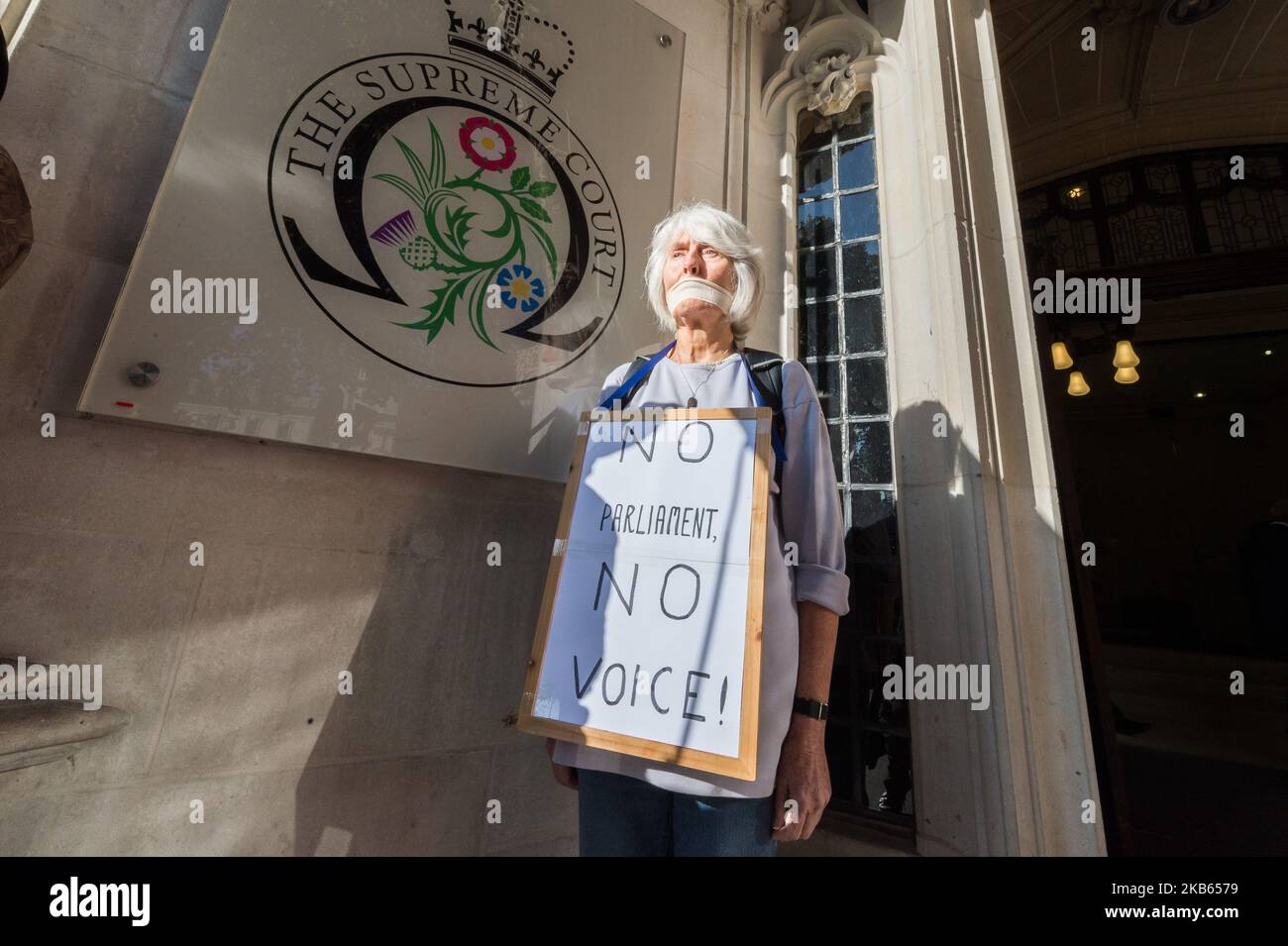 Demonstrators stage a silent protest outside the Supreme Court against Boris Johnson's suspension of parliament on 17 September, 2019 in London, England. Today, the Supreme Court judges begin a three-day hearing over the claim that Prime Minister Boris Johnson acted unlawfully in advising the Queen to prorogue parliament for five weeks in order to prevent MPs from debating the Brexit crisis. (Photo by WIktor Szymanowicz/NurPhoto) Stock Photo