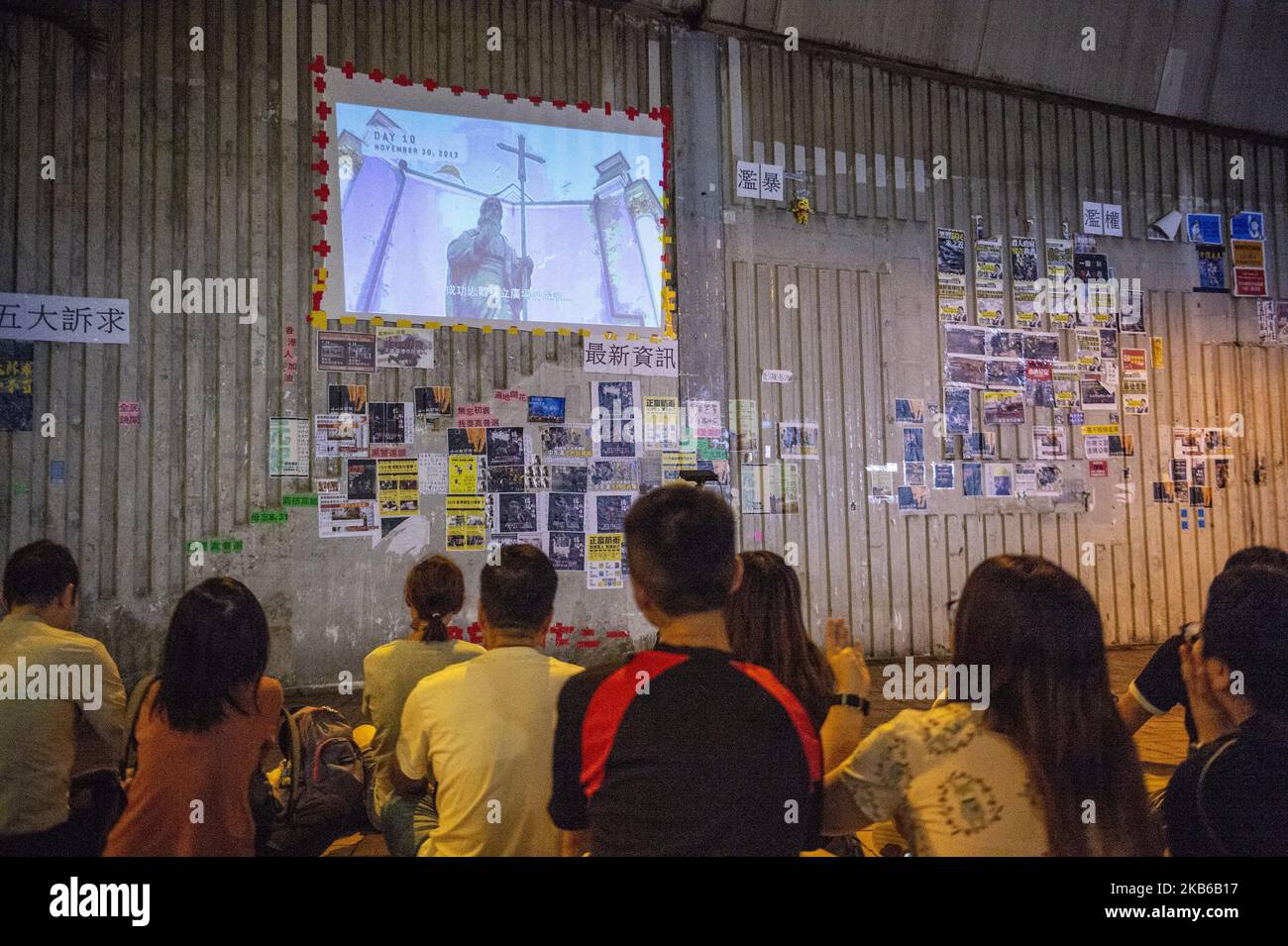 People are seen looking at a screen in Hong Kong on September 19, 2019, Hong Kong has been rocked by. Months of protest (Photo by Vernon Yuen/NurPhoto) Stock Photo