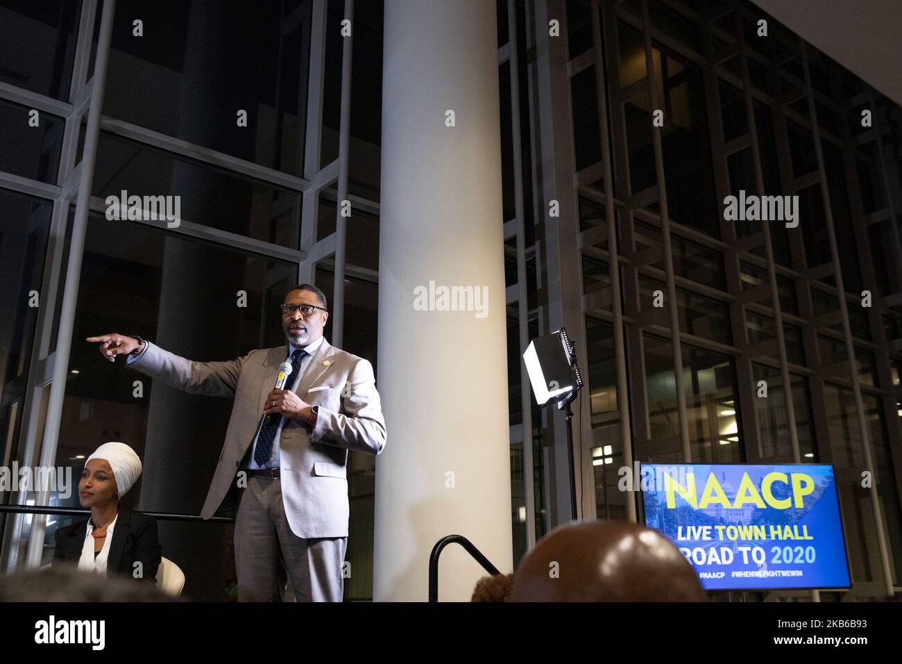 NAACP President and CEO, Derrick Johnson speaks standing by Rep. llhan
