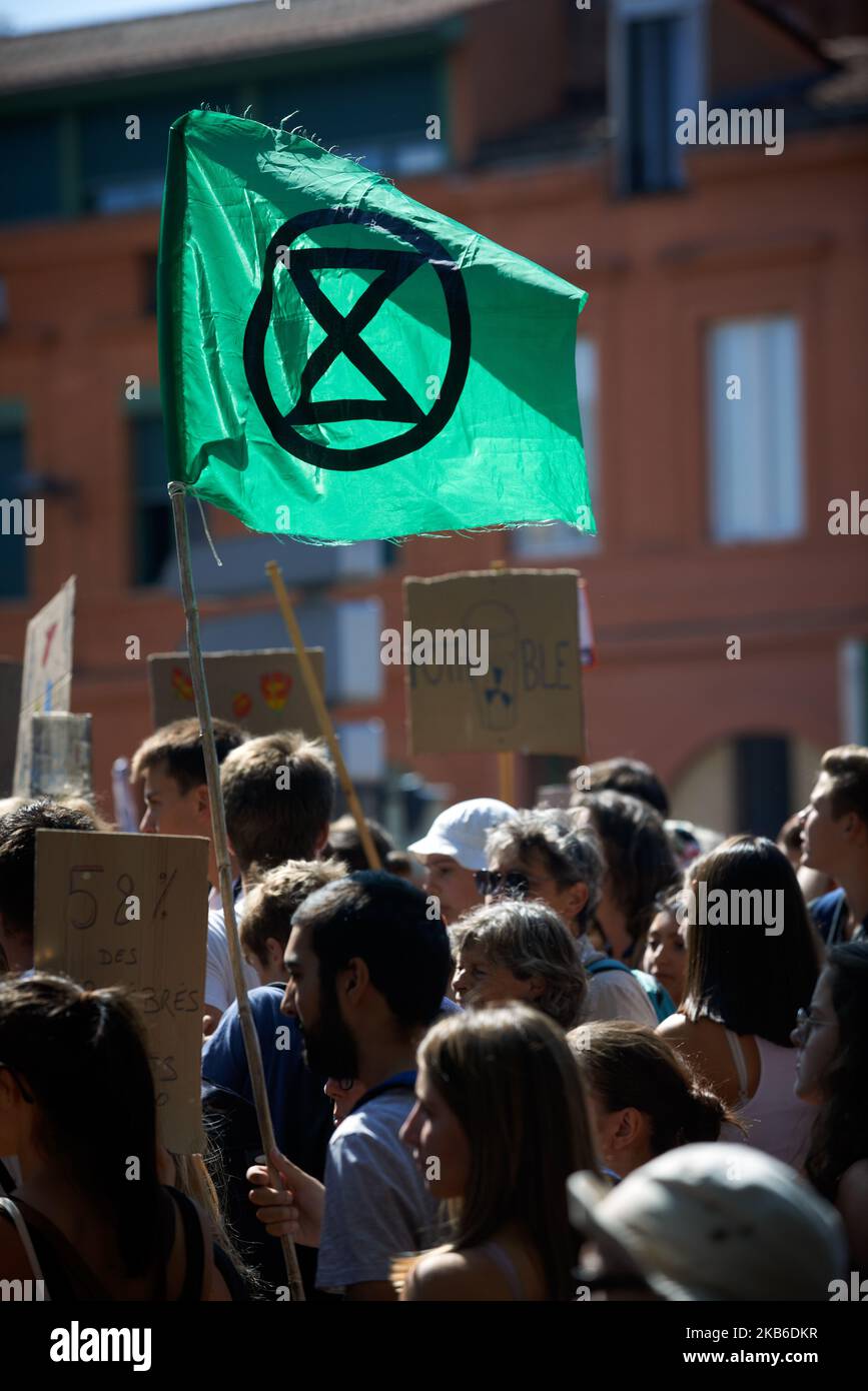 A flag of the XR (Exctinction Rebellion) movement. Following the call of Greta Thunberg for a World School Strike, more than 2500 school students and students took to the streets of Toulouse for the 3rd time to denounce the governments inaction towards the climate crisis. They denounce the lack of action against the environment crisis or the extinction of species. Similar protests took place all over the world. After this protest, they rejoined the March for the Climate.Toulouse. France. September 20th 2019. (Photo by Alain Pitton/NurPhoto) Stock Photo