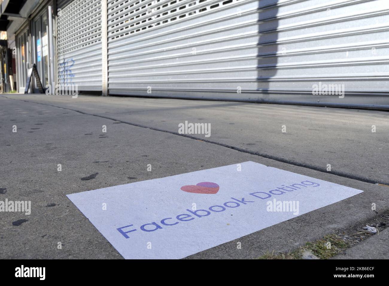 Advertisement for the Facebook dating service is found on sidewalk in the Germantown neighborhood of Philadelphia, PA., on September 20, 2019. Guerrilla Advertising style advertisement for the new dating service is found around town. (Photo by Bastiaan Slabbers/NurPhoto) Stock Photo