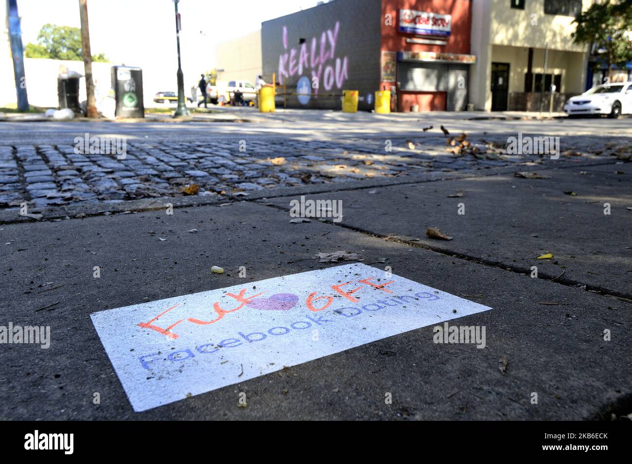 Advertisement for the Facebook dating service is altered with profanity on a sidewalk in the Germantown neighborhood of Philadelphia, PA., on September 20, 2019. Guerrilla Advertising style advertisement for the new dating service is found around town. (Photo by Bastiaan Slabbers/NurPhoto) Stock Photo