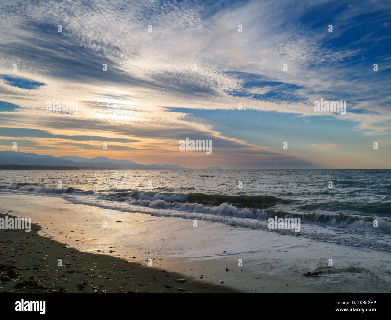 Late afternoon on the shore of the Salish Sea, Dungeness National Wildlive Refuge. Olympic Mountains in distance. Washington, USA. Stock Photo