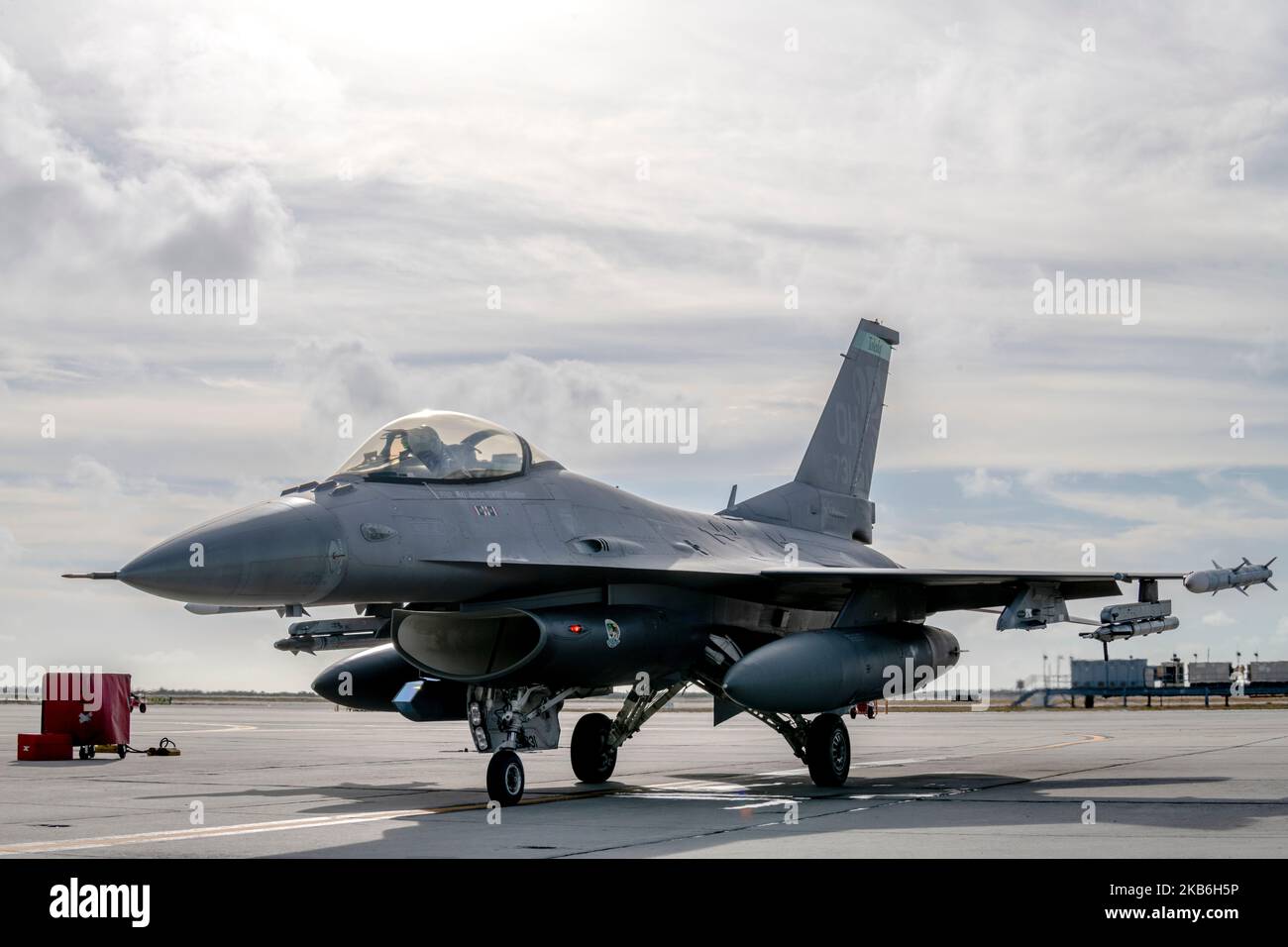 U.S. Air Force Maj. Joshua Caudill, an F-16 fighter pilot assigned to the Ohio National Guard's 180th Fighter Wing, starts a U.S. Air Force F-16 fighting falcon, assigned to the 180FW, before a training flight at Naval Air Station Key West, Nov. 2, 2022. The 180FW deployed to Key West to train with VFC-111, the Navy's premier adversary squadron, providing realistic training scenarios that ensure the 180FW is prepared for homeland defense and contingency operations around the globe.  (U.S. Air National Guard photo by Staff Sgt. Kregg York)  *Some photographic elements have been blurred for secu Stock Photo