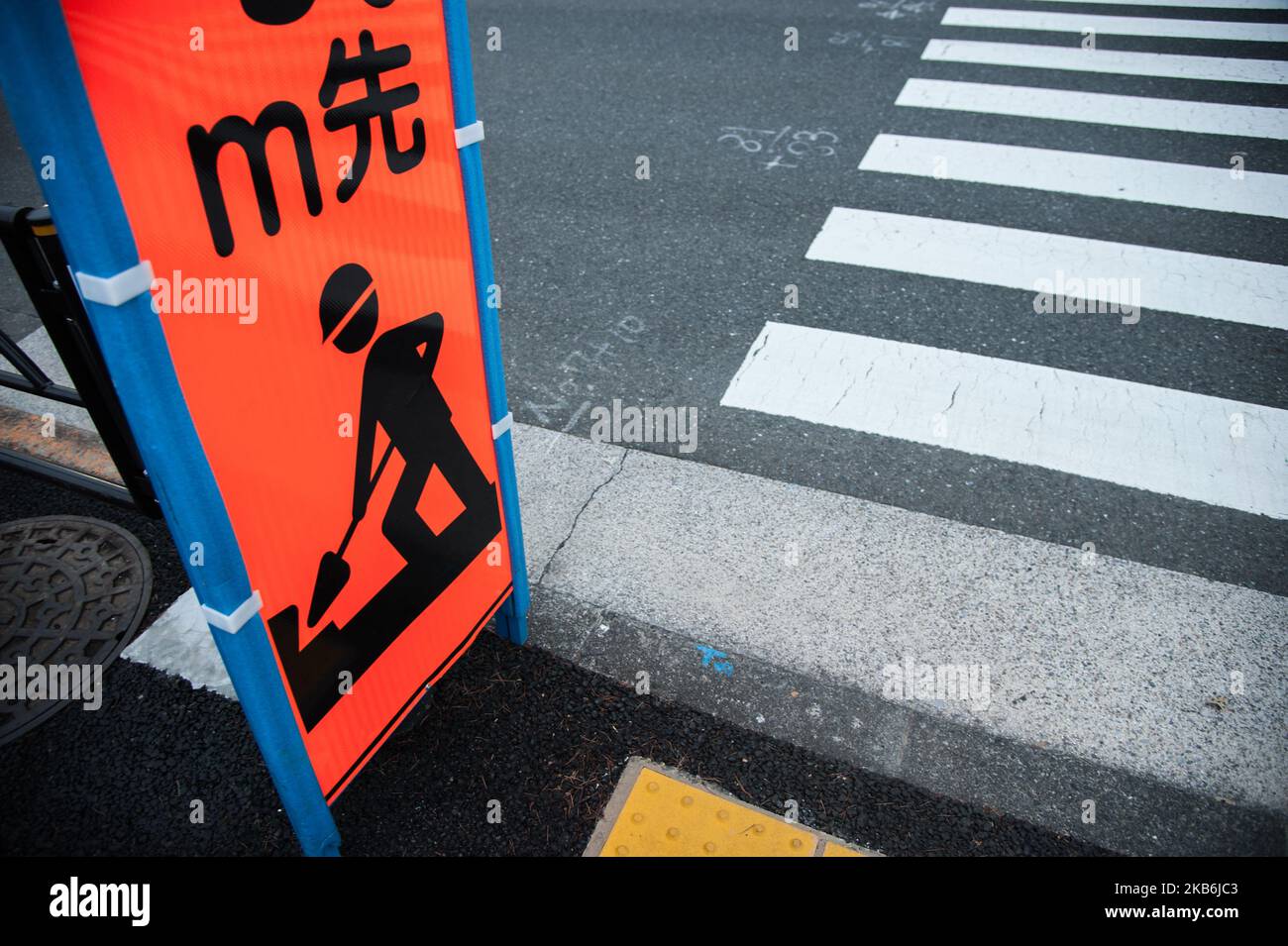 A Worker Sign Is Seen The Building Of The Olympic Stadium Of Tokyo Who a-worker-sign-is-seen-the-building-of-the-olympic-stadium-of-tokyo-who