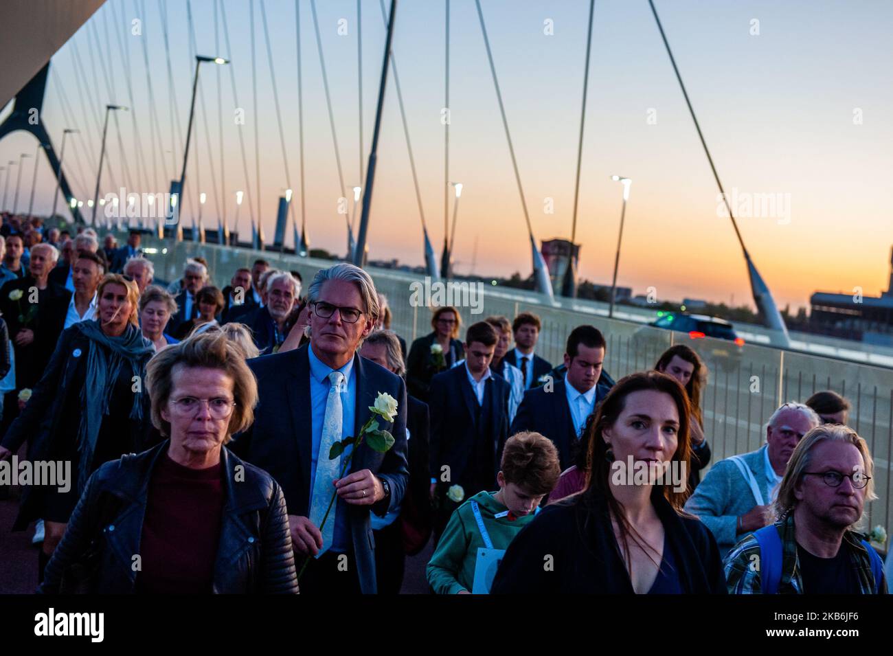This year, 75 years after Operation Market Garden, the Dutch city of Nijmegen celebrate 75 Years of freedom, in Nijmegen, Netherlands, on September 21, 2019. During this Sunset March, they gave special attention to the 48 allied soldiers who died 75 years ago during the heroic crossing of the Waal river. 48 light towers turned on and at the same time, 48 light rays illuminated the sky. This tribute to them was supported by an opera spectacle from the water. The Sunset March ends at the Waalcrossing monument, where people could leave flowers. (Photo by Romy Arroyo Fernandez/NurPhoto) Stock Photo
